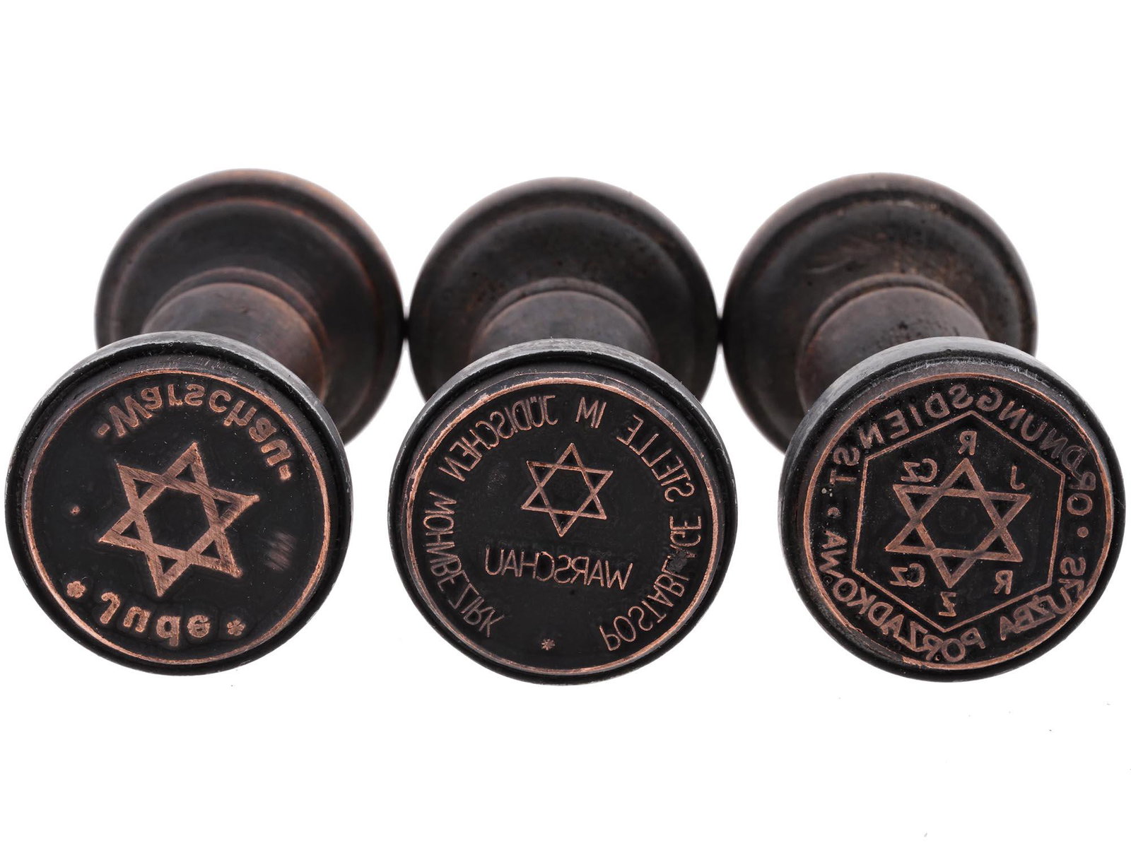 THREE HOLOCAUST PERIOD WARSAW GHETTO HAND STAMPS: A lot of three World War II Polish wooden seals of ghetto administrations. Warschau Jude, Warsaw Jew. Postablage Stelle im Judischen Wohnbezirk Warschau, Post office in the Jewish residential district