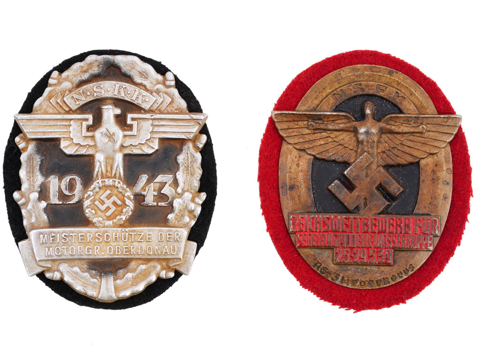 WWII NAZI GERMAN ERA NSKK AND NSFK AWARD SHIELDS: A lot of WWII Nazi German Third Reich era NSKK and NSFK award shields. The lot includes a German 1943 NSKK Motorgruppe Oberdonau shield, in the front of the shield reads Meisterschutze der Motor GR Ob
