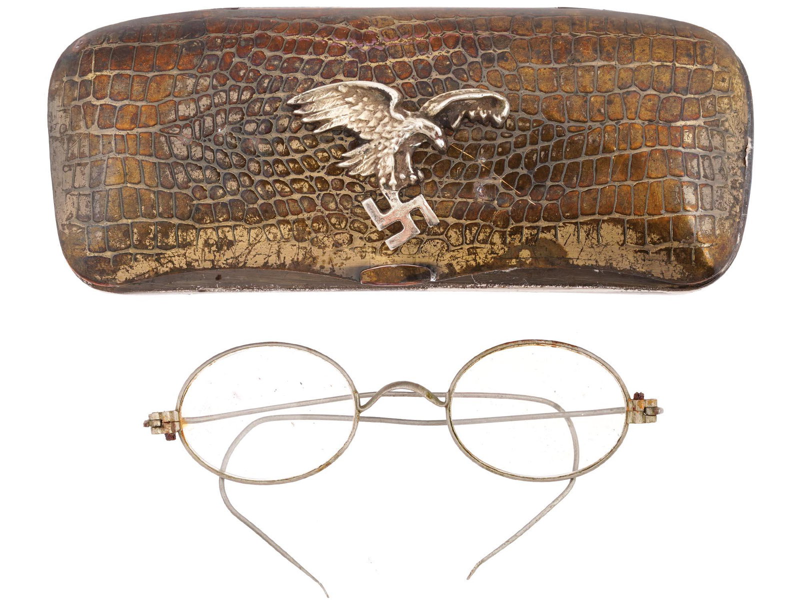 GERMAN WWII LUFTWAFFE OFFICIALS GLASSES WITH CASE: A pair of World War II German Luftwaffe officials eye glasses. Oval shape, metal frame. The glasses come in a leather case decorated with overlay Reichsadler and swastika. Second World War Historical 