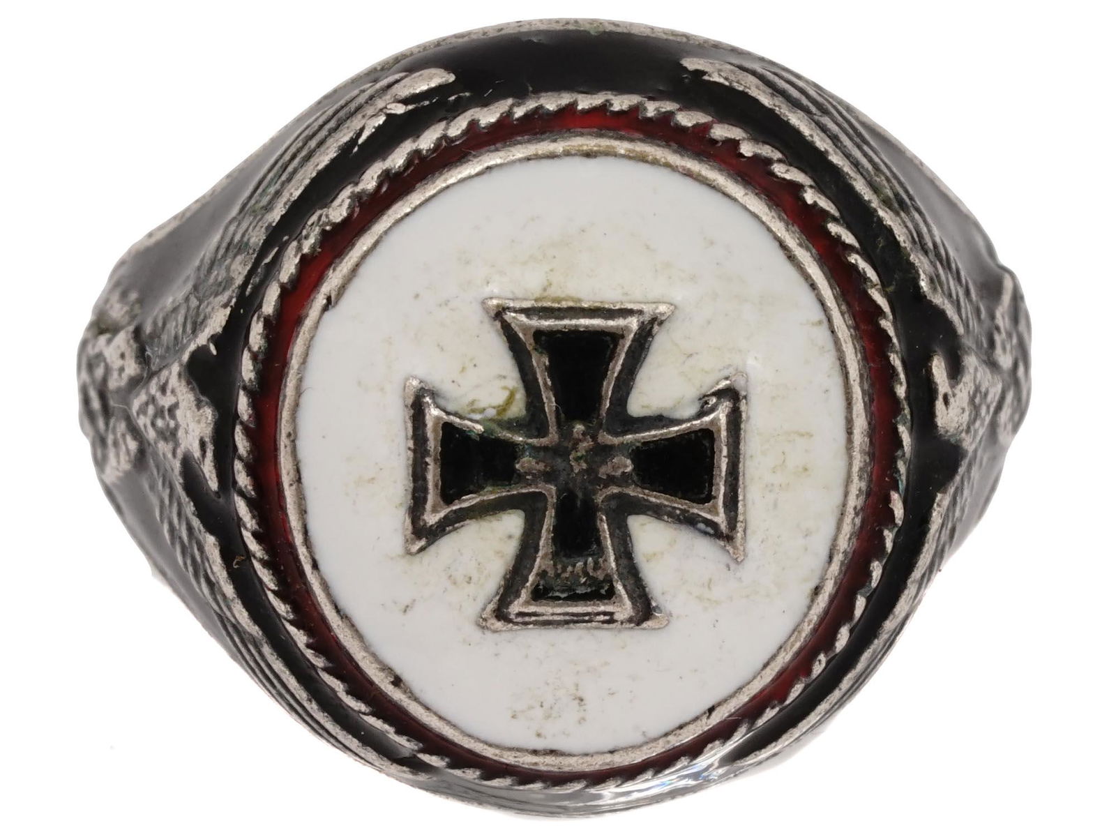 GERMAN WWII IRON CROSS WINNER'S SILVER ENAMELED RING: A WWII Nazi German Third Reich Iron Cross Winners silver enameled ring. The ring is adorned with an engraved image of an Iron Cross, covered with enamel in black, red, and white shades, and an image o