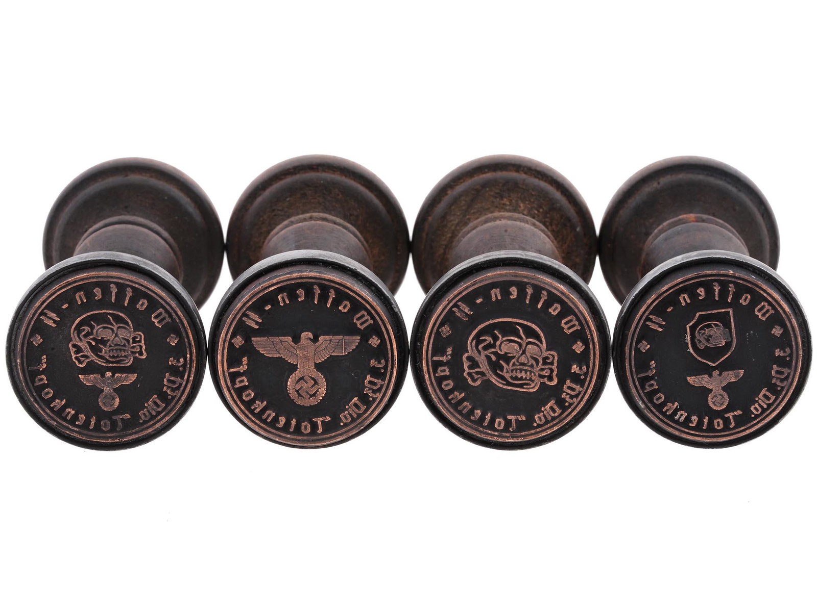 GROUP OF 4 GERMAN WWII HAND STAMPS: A lot of four World War II Nazi German wooden seals of the Waffen SS 3. Panzer Division Totenkopf. The 3rd SS Panzer Division Totenkopf was an elite division of the Waffen SS. Second World War Histori