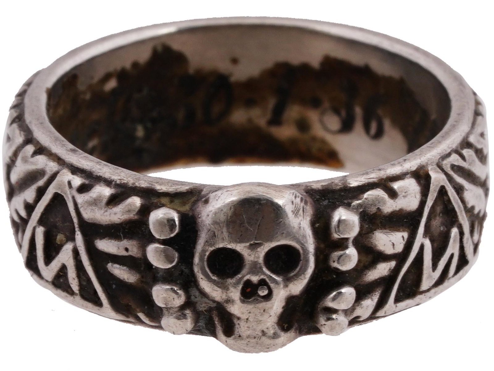 WWII NAZI GERMAN THIRD REICH SS HIMMLER HONOR RING: A WWII Nazi German Third Reich SS Himmler Honor, probably silver, ring. The exterior of the ring is engraved with oak leaves and swastika insignia patterns, and a Totenkopf swastika insignia in the ce