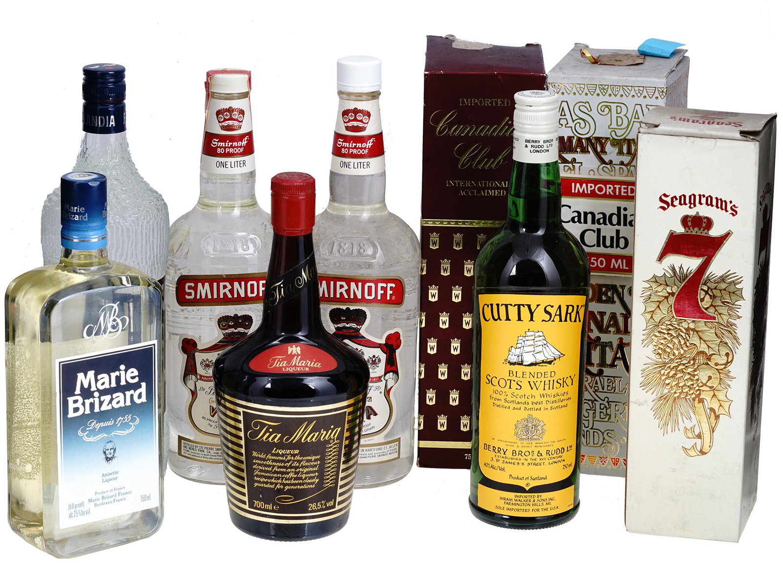 CANADIAN CLUB MARIE BRIZARD LIQUEUR BOTTLES IOB: A lot of vintage liqueur bottles. A total of 9 items. Finlandia Vodka. Smirnoff Vodka, two bottles. Marie Brizard Anisette Liqueur. Tia Maria Liqueur. Cutty Sark Blended Scots Whiskey. Canadian Club B