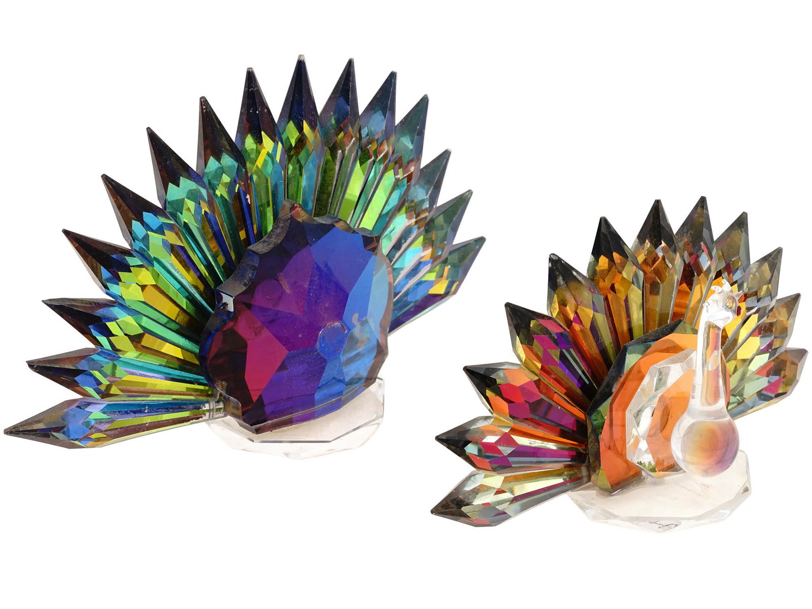 VINTAGE IRIDISCENT CRYSTAL PEACOCK FIGURINES: A pair of vintage Swarovski-style crystal figurines representing peacocks. Iridiscent figures in pink and blue color palettes, a part of the blue figurine is missing. Home Decor For Interior Design, G