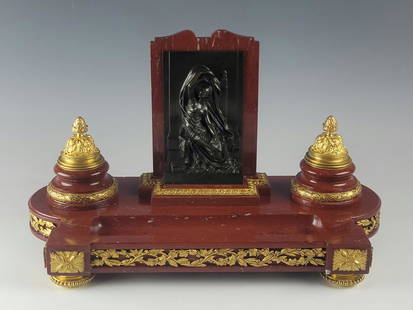 19 C FRENCH MARBLE BRONZE INKWELL BY HENRI CHAPU: A fine large 19th century French rouge marble, gilt and patinated bronze inkwell by Henri Michel Antoine Chapu, 1833 to 1891. A neoclassical inkwell designed with a beveled gritted marble foundation w