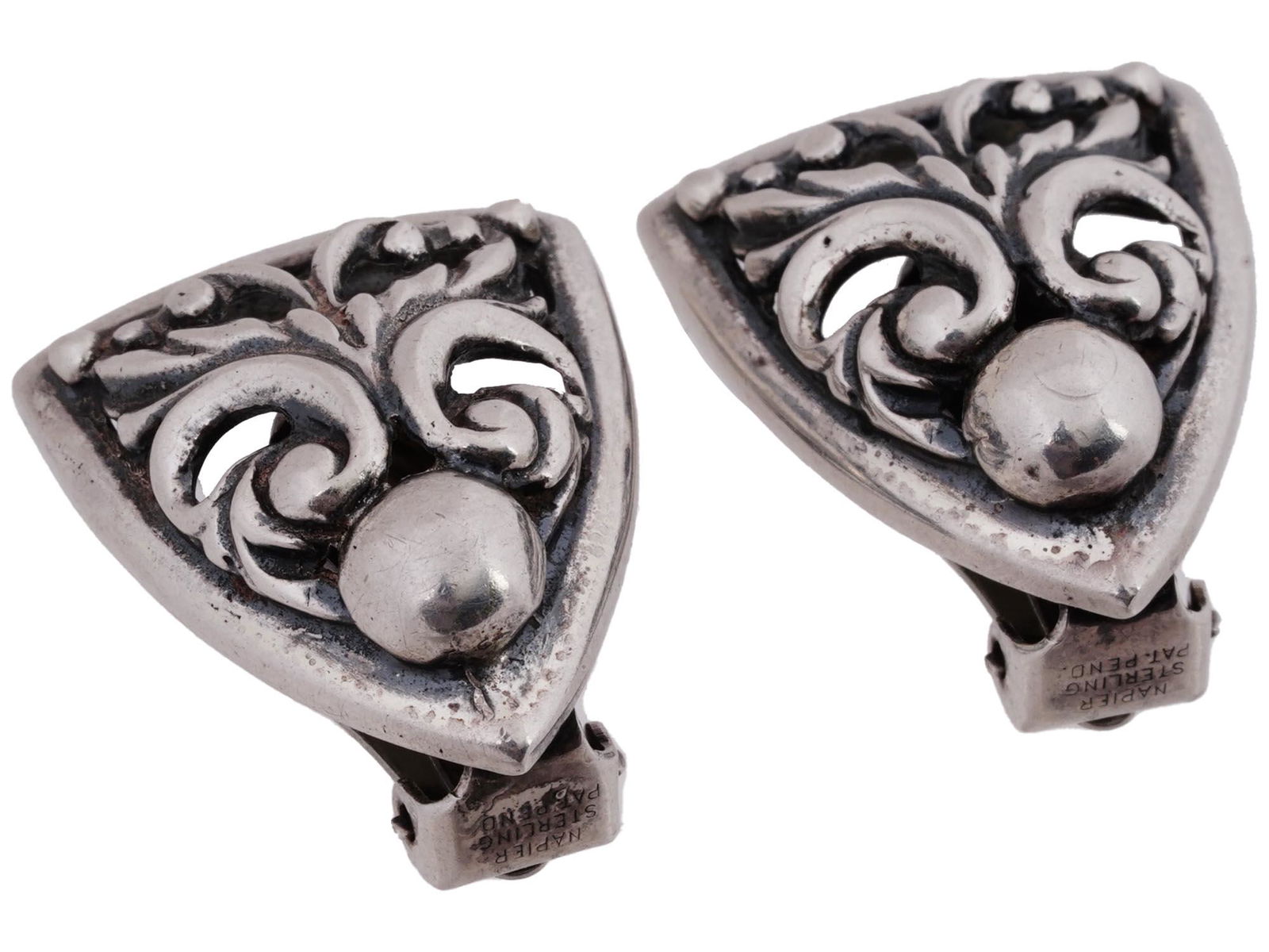 NAPIER STERLING SILVER COSTUME JEWELRY CLIP EARRINGS: A pair of Napier Sterling Silver costume jewelry earrings ear clips. The earrings are made in an openwork scrollwork design. Marked with a Sterling Silver hallmark, and a Napier Sterling Pat. Pend mar