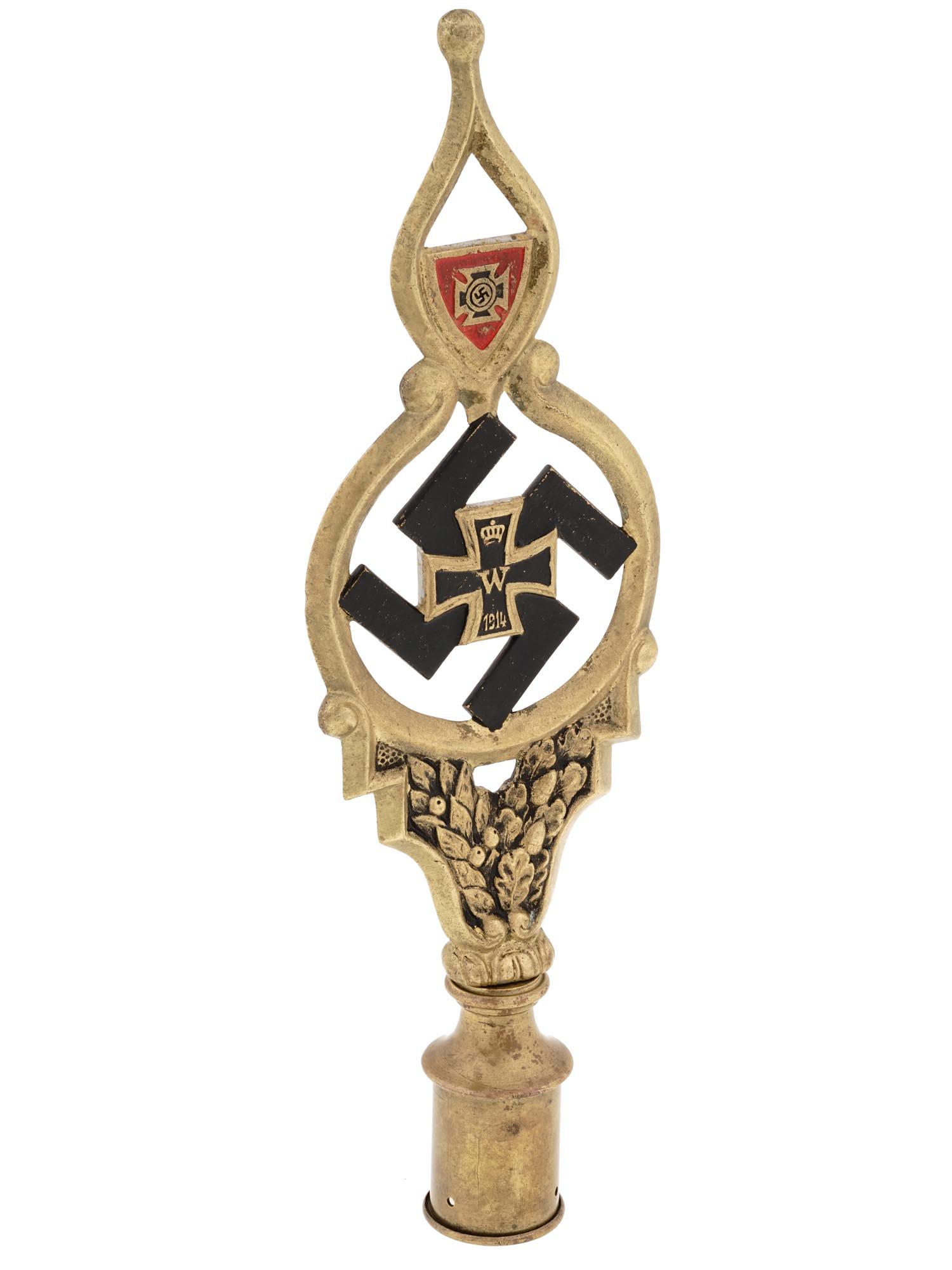 WWII NAZI GERMAN BATTLEFIELD FLAGPOLE TOP WITH SWASTIKA: A WWII Nazi German battlefield flagpole top. Features a meticulously crafted iron cross, a powerful emblem associated with German military tradition, applied to a black swastika. The craftsmanship of 