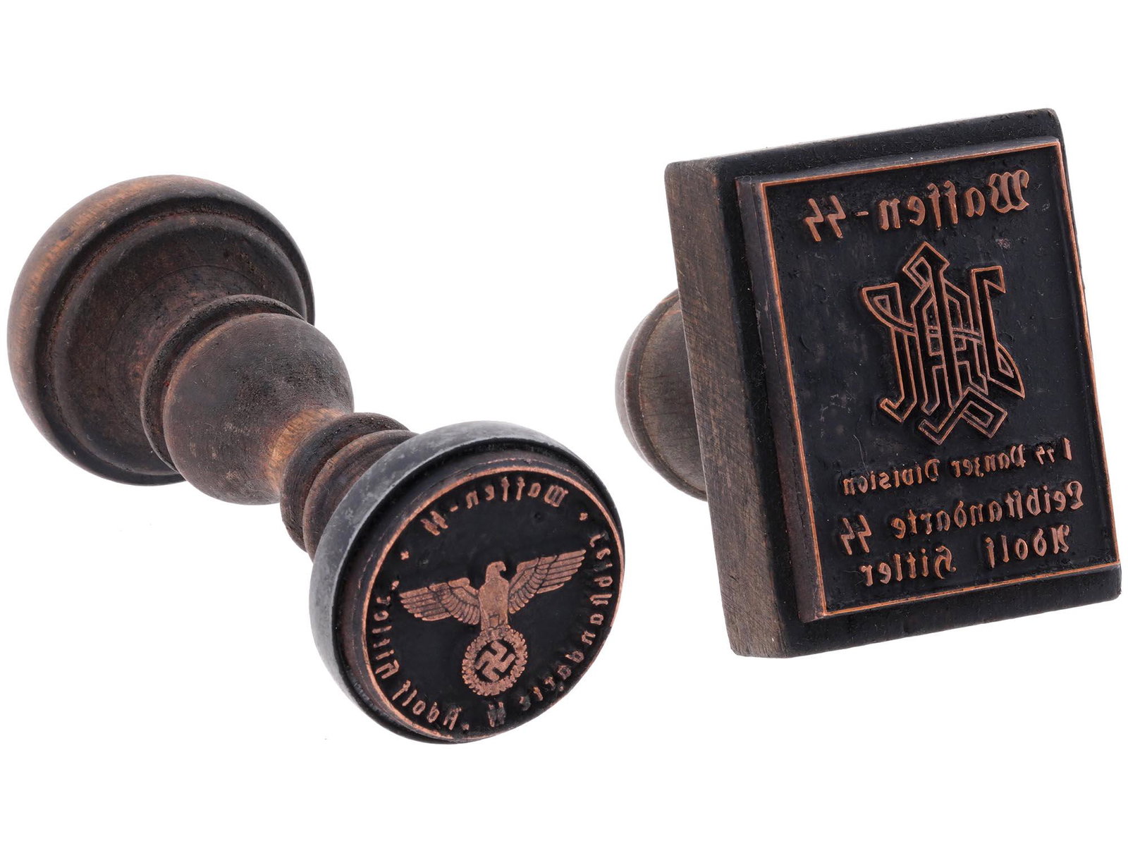 PAIR OF GERMAN WWII HAND STAMPS: A lot of two World War II Nazi German wooden seals of Waffen SS Leibstandarte Adolf Hitler. The 1st SS Panzer Division Leibstandard Adolf Hitler began as Adolf Hitlers personal bodyguard unit and even
