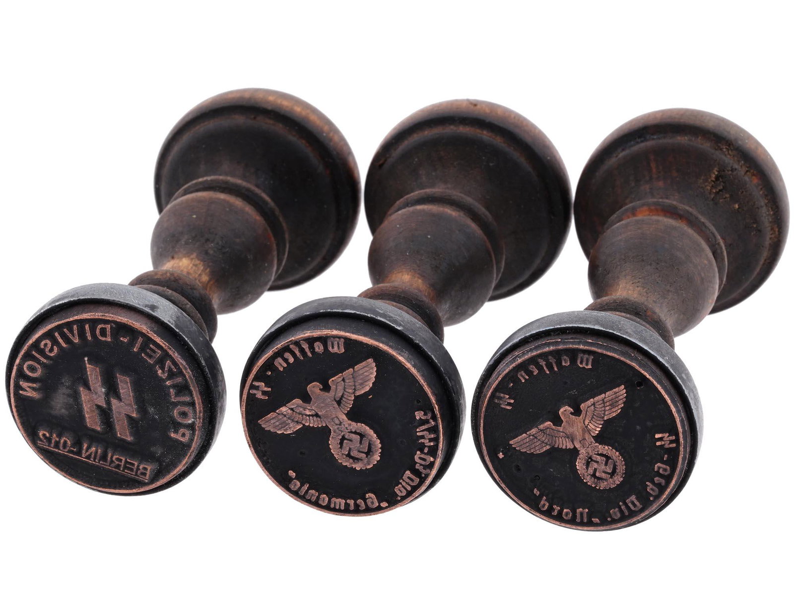 GROUP OF 3 GERMAN WWII HAND STAMPS: A lot of three World War II Nazi German wooden seals of various Waffen SS divisions. SS Polizei Division Berlin 012, Waffen SS Panzer Division Germania, Waffen SS Mountain Division Nord. Second World 