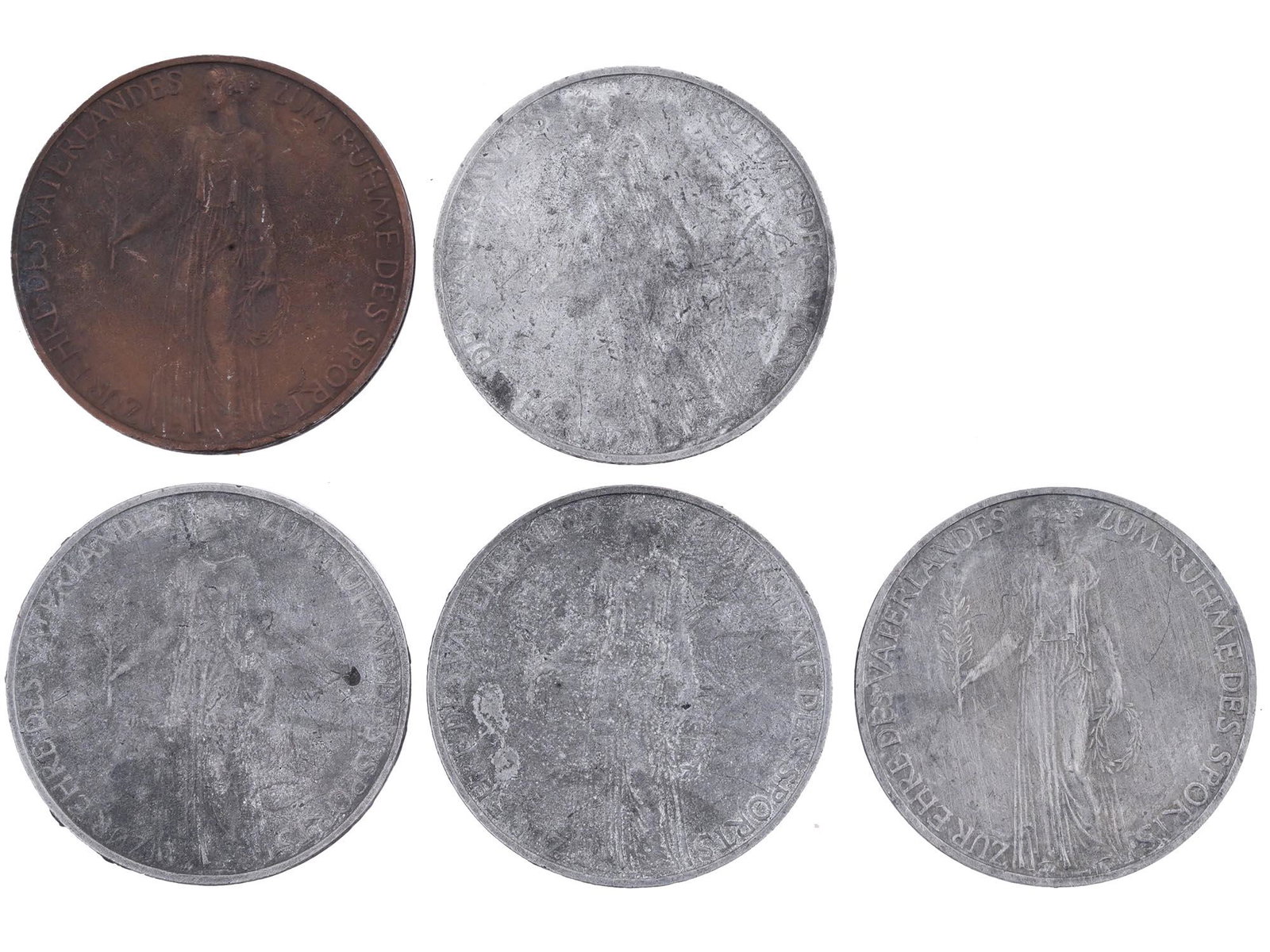 GROUP OF FIVE 1936 BERLIN OLYMPICS SOUVENIR MEDALS: A group of five 1936 Berlin Olympics souvenir medals, each featuring the woman in robes holding a branch and wreath and the lettering In Honor of the Fatherland to the Glory of Sports to the obverse, 
