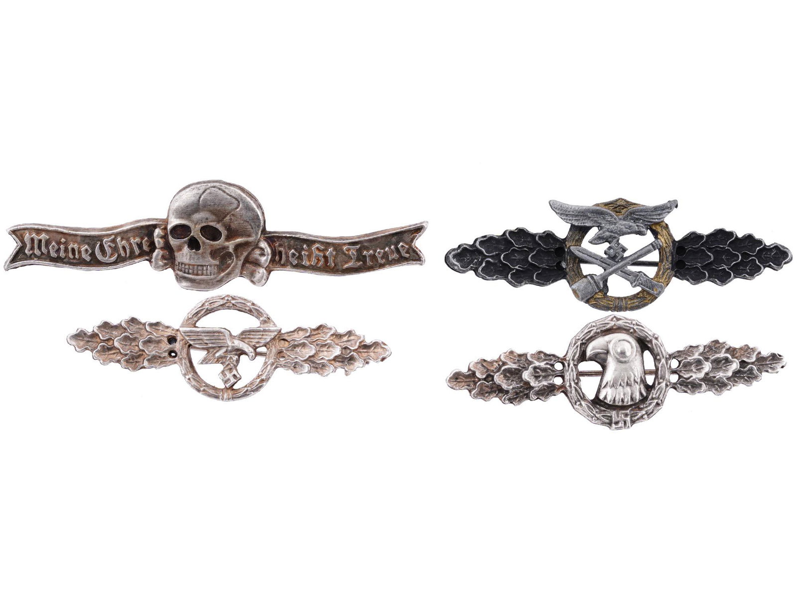 WWII NAZI GERMAN LUFTWAFFE AND WAFFEN SS CLASPS: A group of four WWII Nazi German clasps including Luftwaffe Reconnaissance, Luftwaffe Glider Squadron, Luftwaffe Close Combat. All three with pinbacks. The lot also includes WWII German Waffen SS even