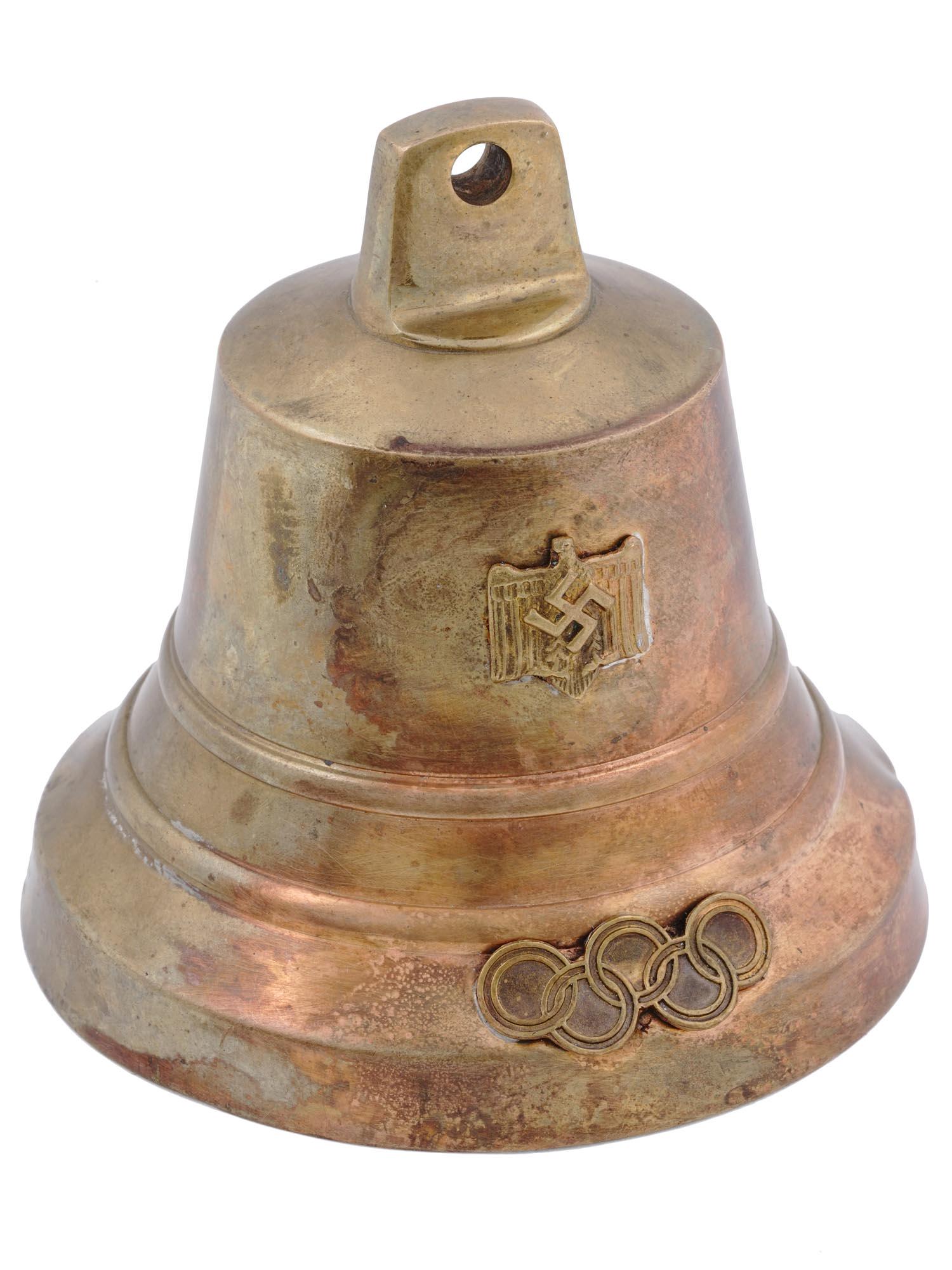 1936 XI OLYMPIC GAMES IN BERLIN CAST STEEL BELL: A WWII Nazi German Third Reich cast steel bell from the XI Olympic Games in Berlin 1936. A relief image of a Nazi eagle with a swastika insignia to the center, and five Olympic rings. A significant Ol