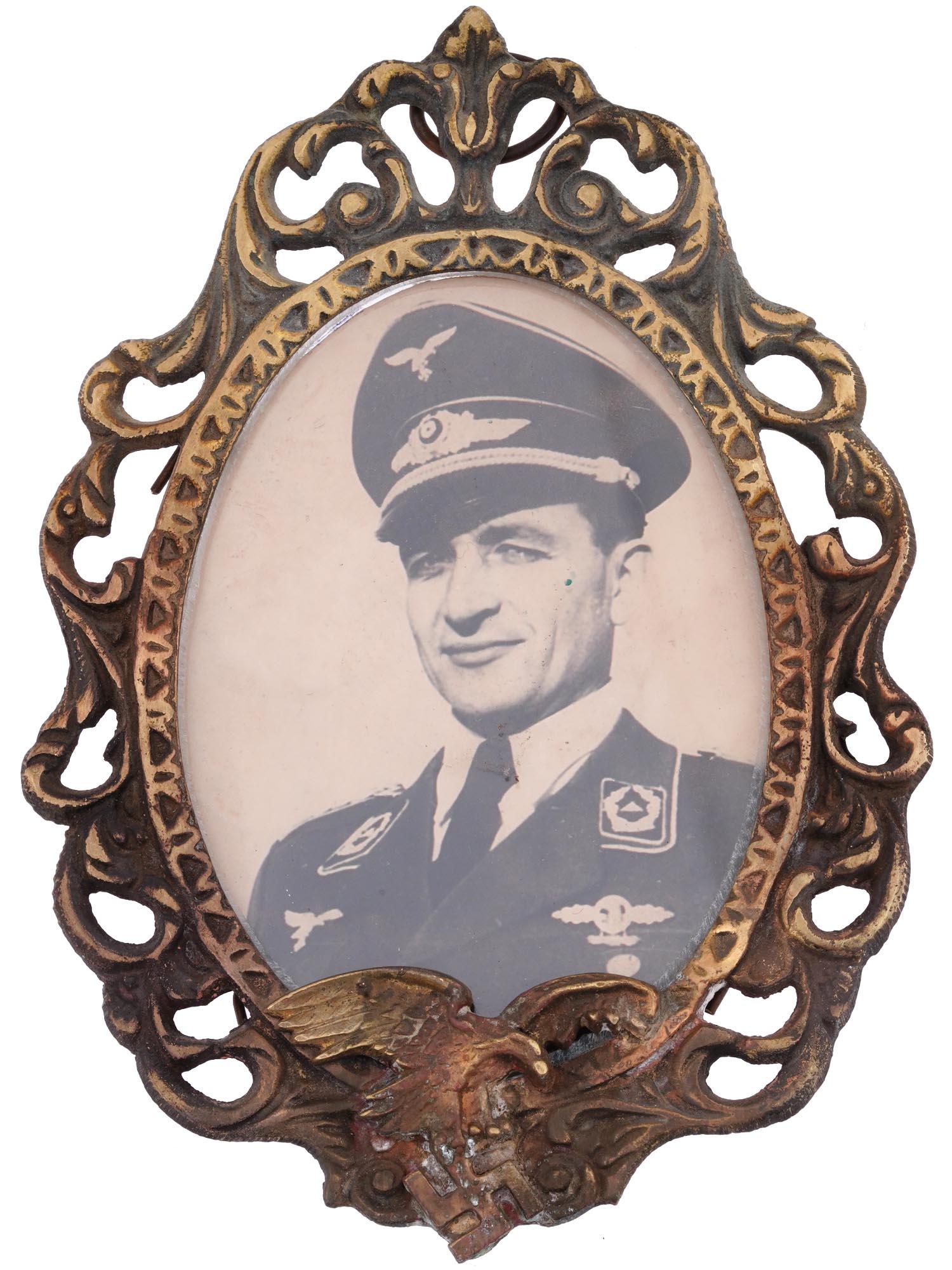 GERMAN WWII LUFTWAFFE PILOTS PHOTO FRAME: A WWII Nazi German Third Reich Luftwaffe Pilots cast metal photo frame. The frame is made in an openwork scrollwork design, and adorned with a relief image of a Nazi eagle, lower to the center. Comple