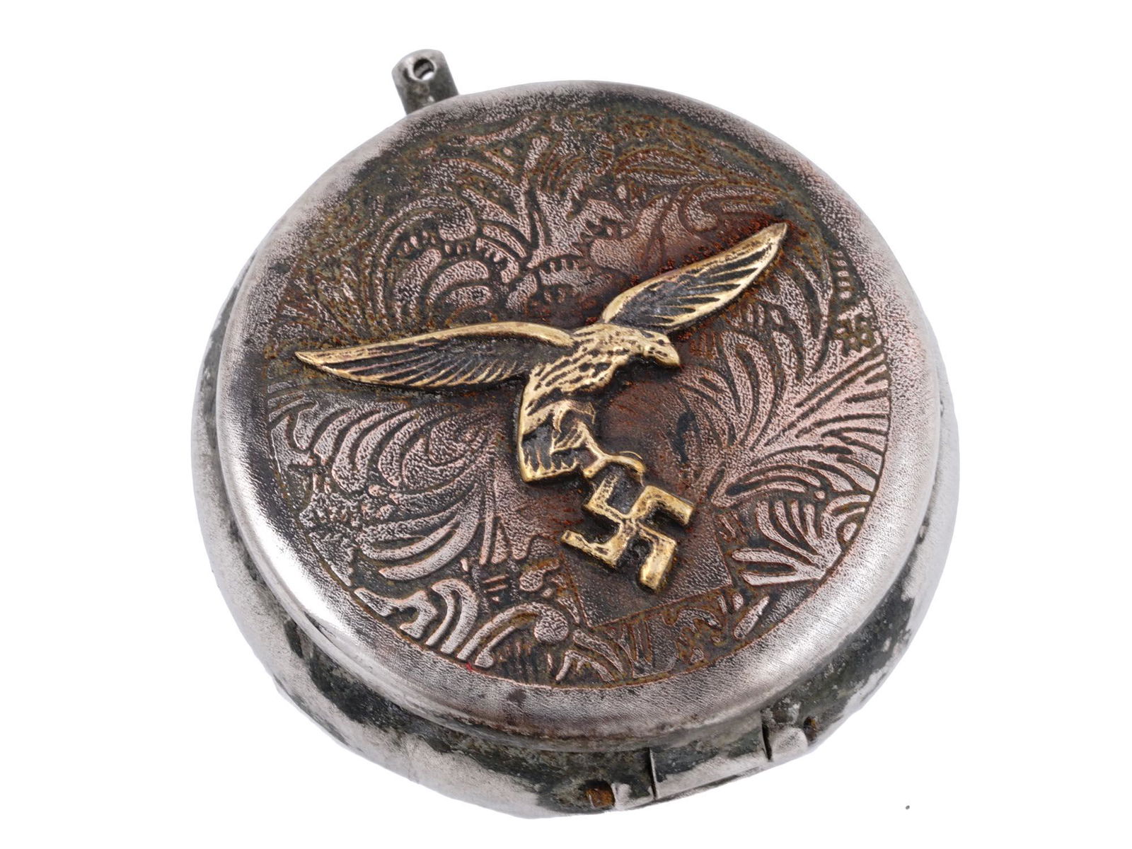 GERMAN WWII LUFTWAFFE PILOTS POCKET ASH TRAY: A WWII Nazi German Third Reich Luftwaffe Pilots stainless steel military pocket ashtray with a hinged lid. The lid is decorated with an embossed foliage pattern and a gilt overlay Reichsadler, Nazi ea