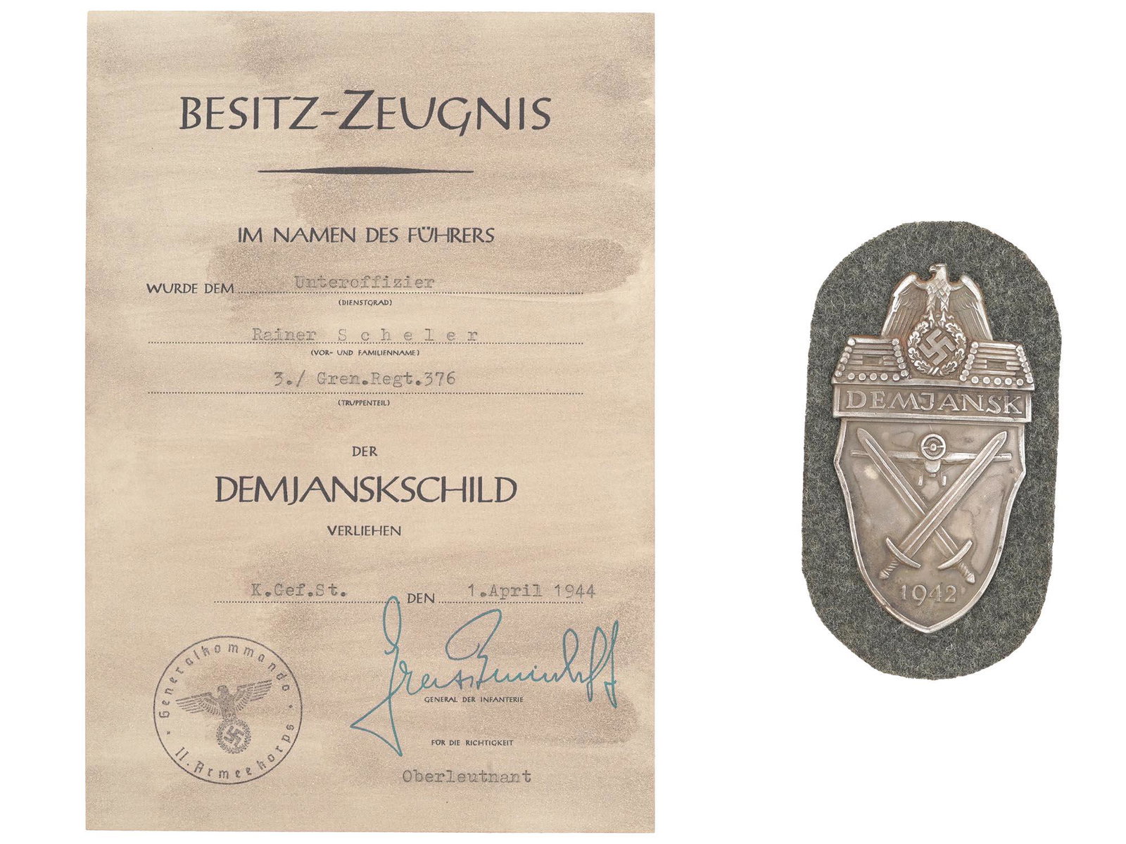 WWII NAZI GERMAN DEMYANSK SHIELD WITH CERTIFICATE: A World War II German military decoration, the Demyansk Shield, Armelschild Demjansk in German. The zinc badge features an eagle with with swastika, flanked by two log pillboxes with gun ports and ins