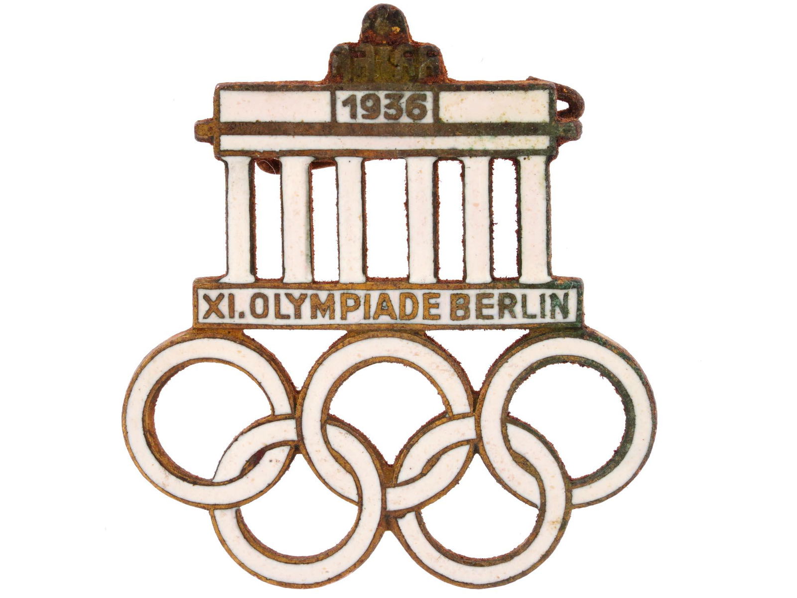 GERMAN BERLIN 1936 OLYMPIC GAMES ENAMELED PIN: A collectible official German Olympic Games pin commemorating the 1936 Olympic Games in Berlin. The pin is modeled as the Brandenburg gates above the five interlocking Olympic circles, with 1936 date