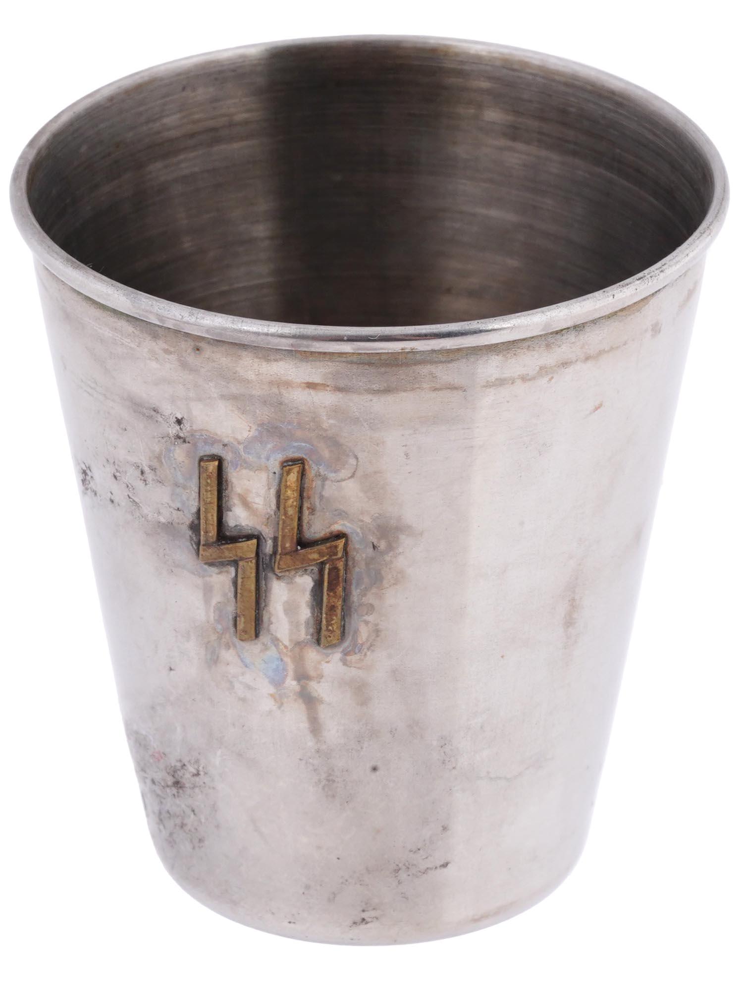 WWII NAZI GERMAN CARL WUSTHOF SS SHOT: A Nazi German SS double shot glass made of silver tone metal with applied brass SS insignia to each side. Maker marked to the bottom: Carl Wusthof of Solingen. Second World War Historical Collectibles