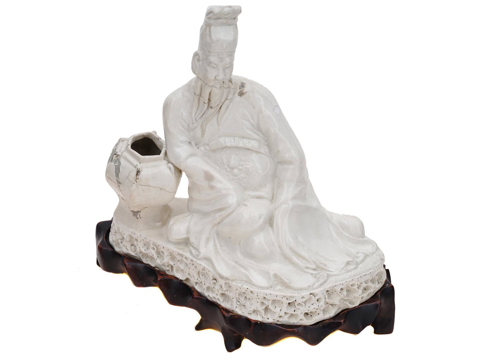 ANTIQUE BLANC DE CHINE PORCELAIN CONFUCIUS FIGURE: An antique Chinese glazed Dehua porcelain sculpture. Late Qing dynasty, before 1912. The artwork represents Confucius, a Chinese philosopher and politician who lived in the 6-5th century BC. Embossed 