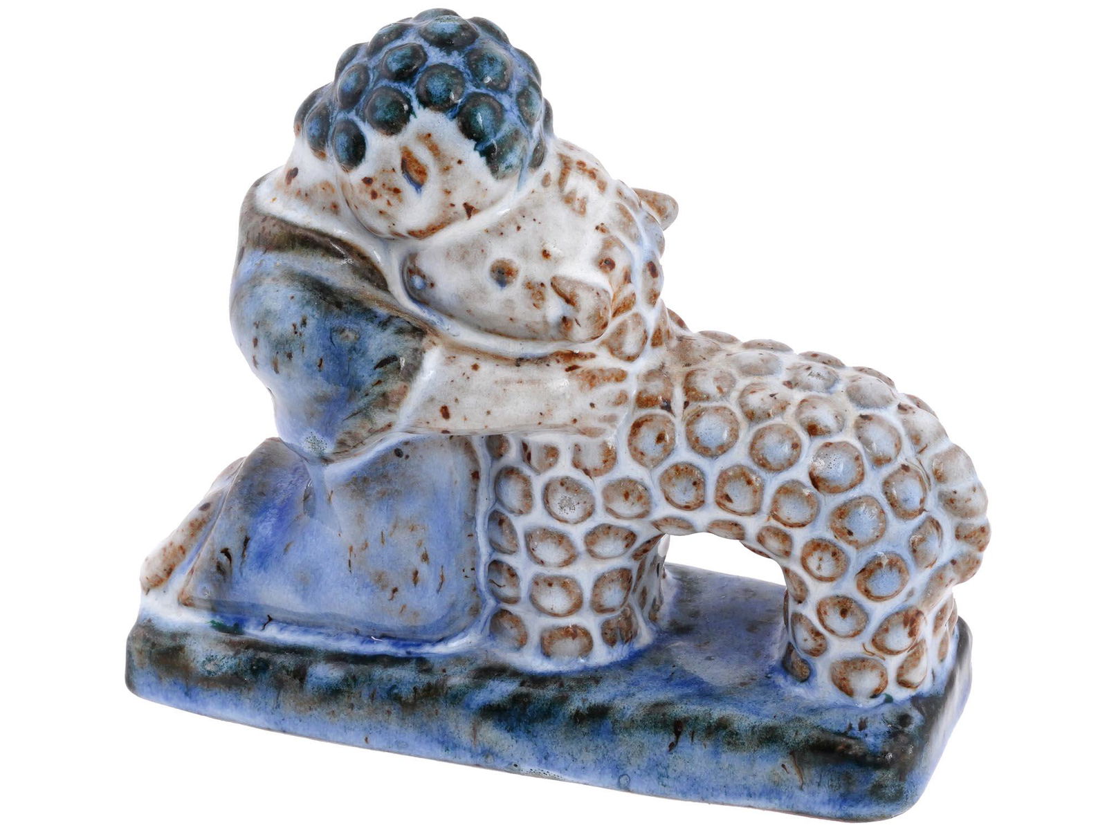 L. HJORTH DENMARK POTTERY GIRL AND LAMB FIGURINE: A mid-20th century glazed ceramic figurine by L. Hjorth Factory. The piece represents a child embracing a white lamb. Embossed mark L. Hjorth Denmark 515 is on the bottom. Lauritz Adolph Hjorth, 1834