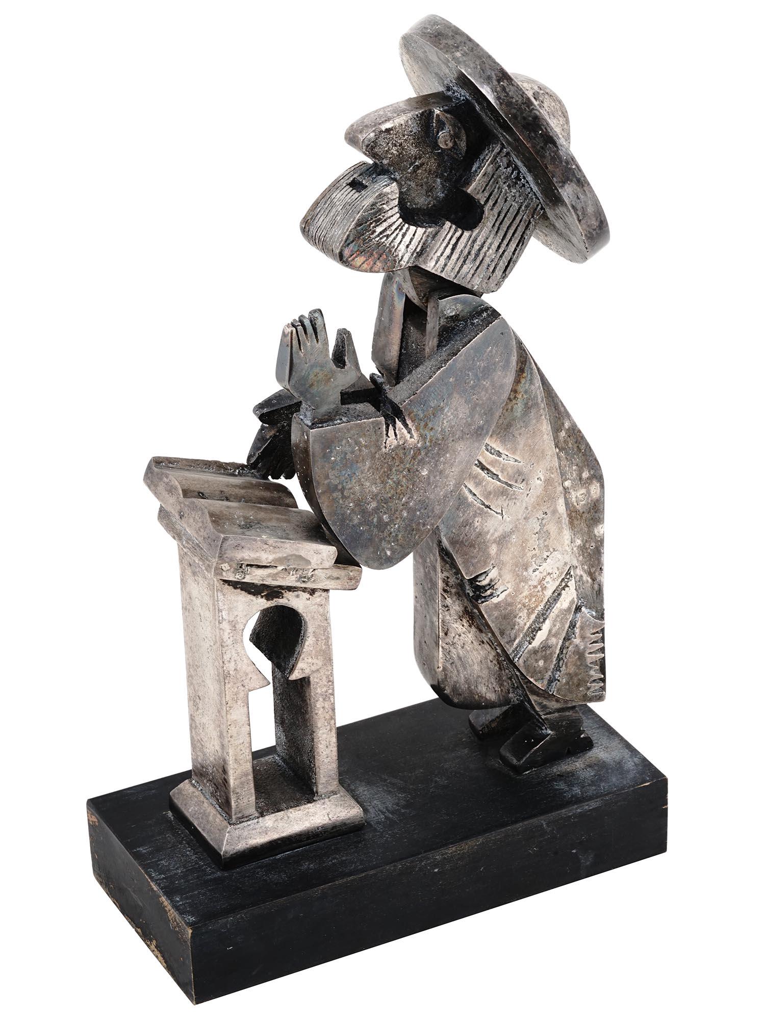 ISRAELI BRONZE SCULPTURE OF RABBI AFTER FRANK MEISLER: After Frank Meisler, Israeli, 1925 to 2018, bronze sculpture showing a rabbi at prayer. The figure seems cartoon-like with exaggerated facial features. The head is kinetic and bobs back and forth. Mar