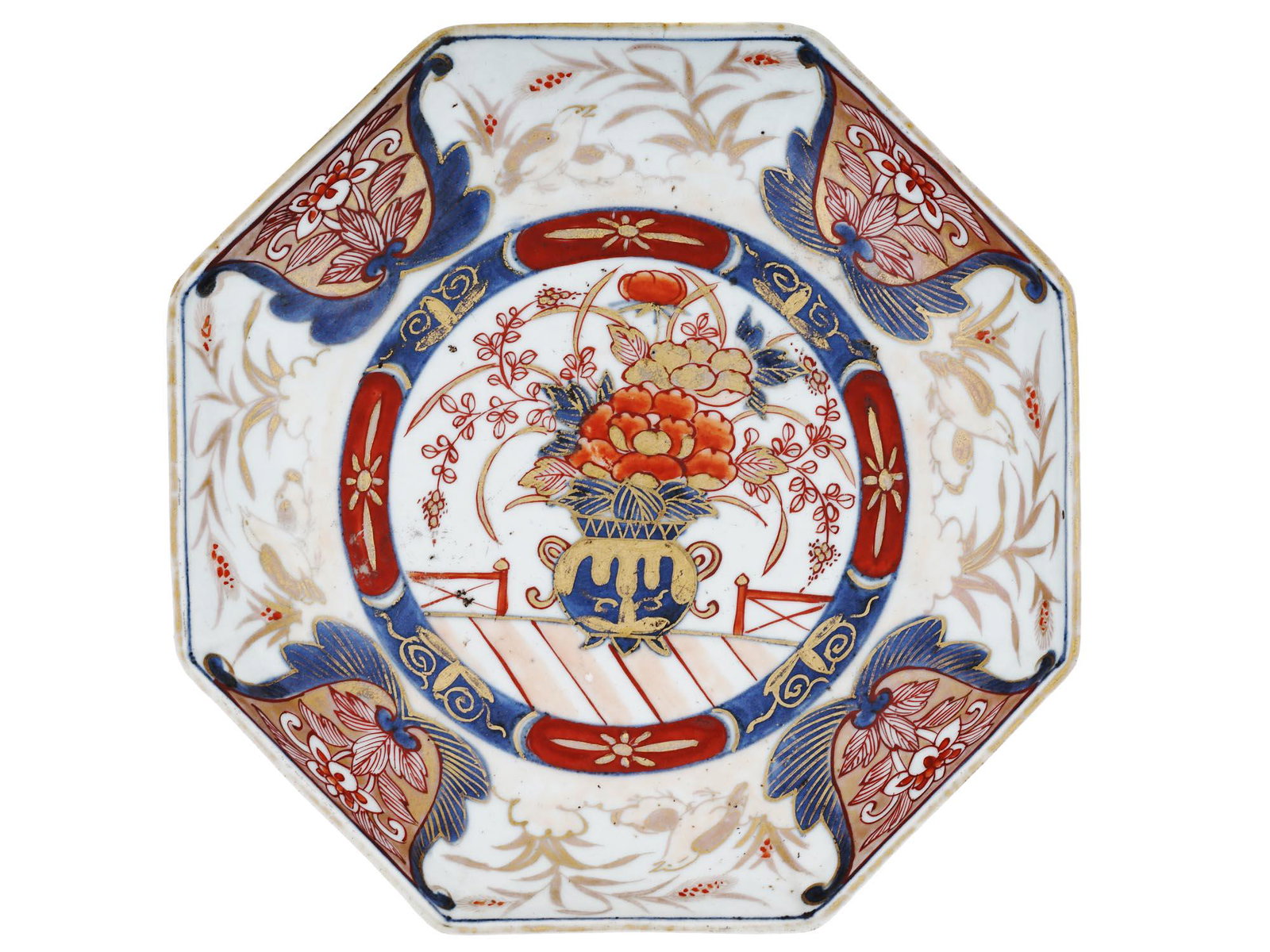 LARGE ANTIQUE JAPANESE MEIJI IMARI PORCELAIN PLATE: A large antique Japanese, late Meiji era, hand enameled porcelain charger plate. The plate is hand painted with Imari decor, an image of bouquet of flowers in a vase, surrounded by floral and foliage 