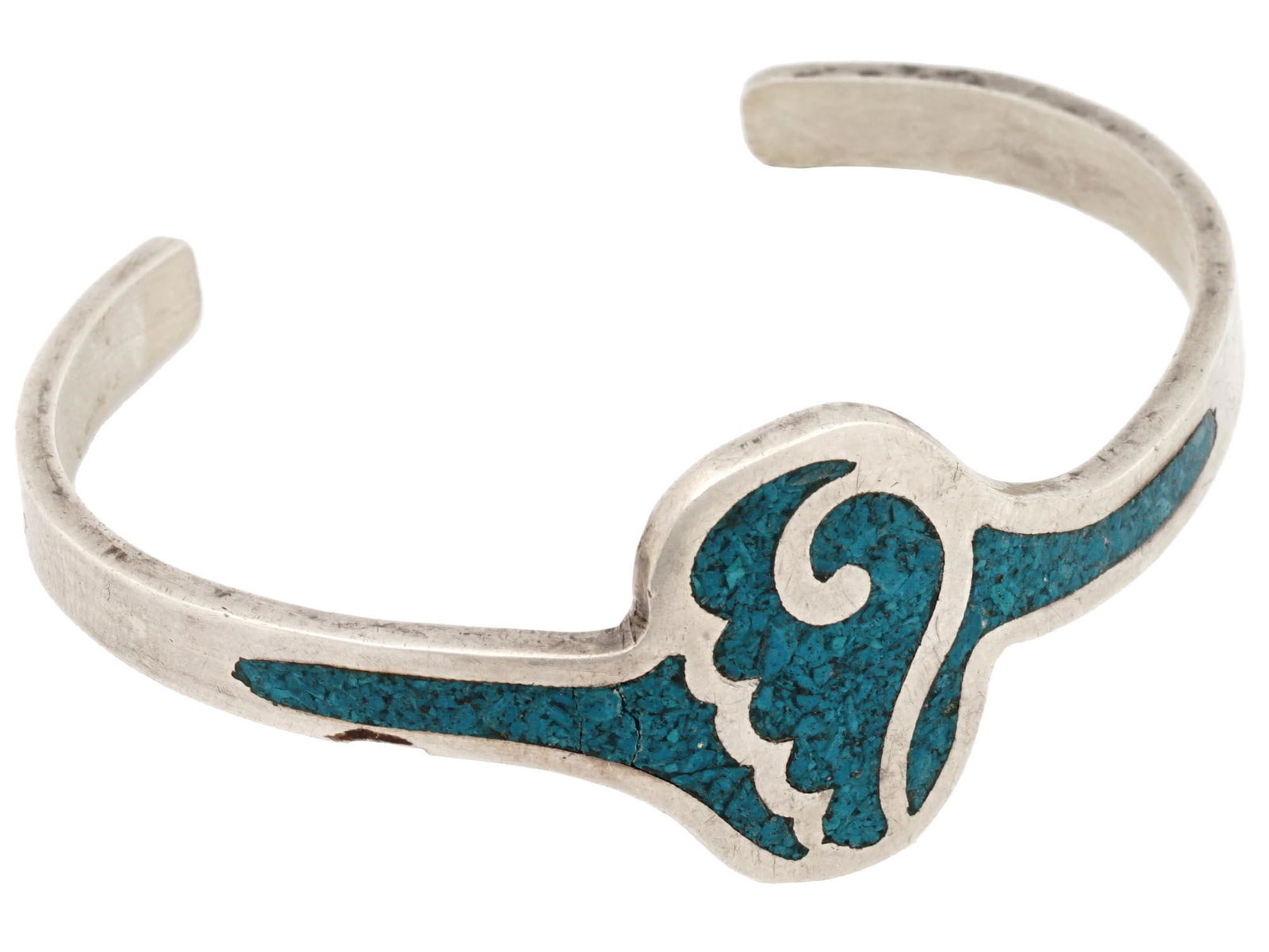 NAVAJO SILVER CRUSHED TURQUOISE BANGLE BRACELET: A vintage sterling silver open bangle bracelet with crushed turquoise Aztec decor. Presumably of Navajo origin. Hallmark Sterling H is on the inner side. Weight: 20 grams. Native American Tribal Jewel