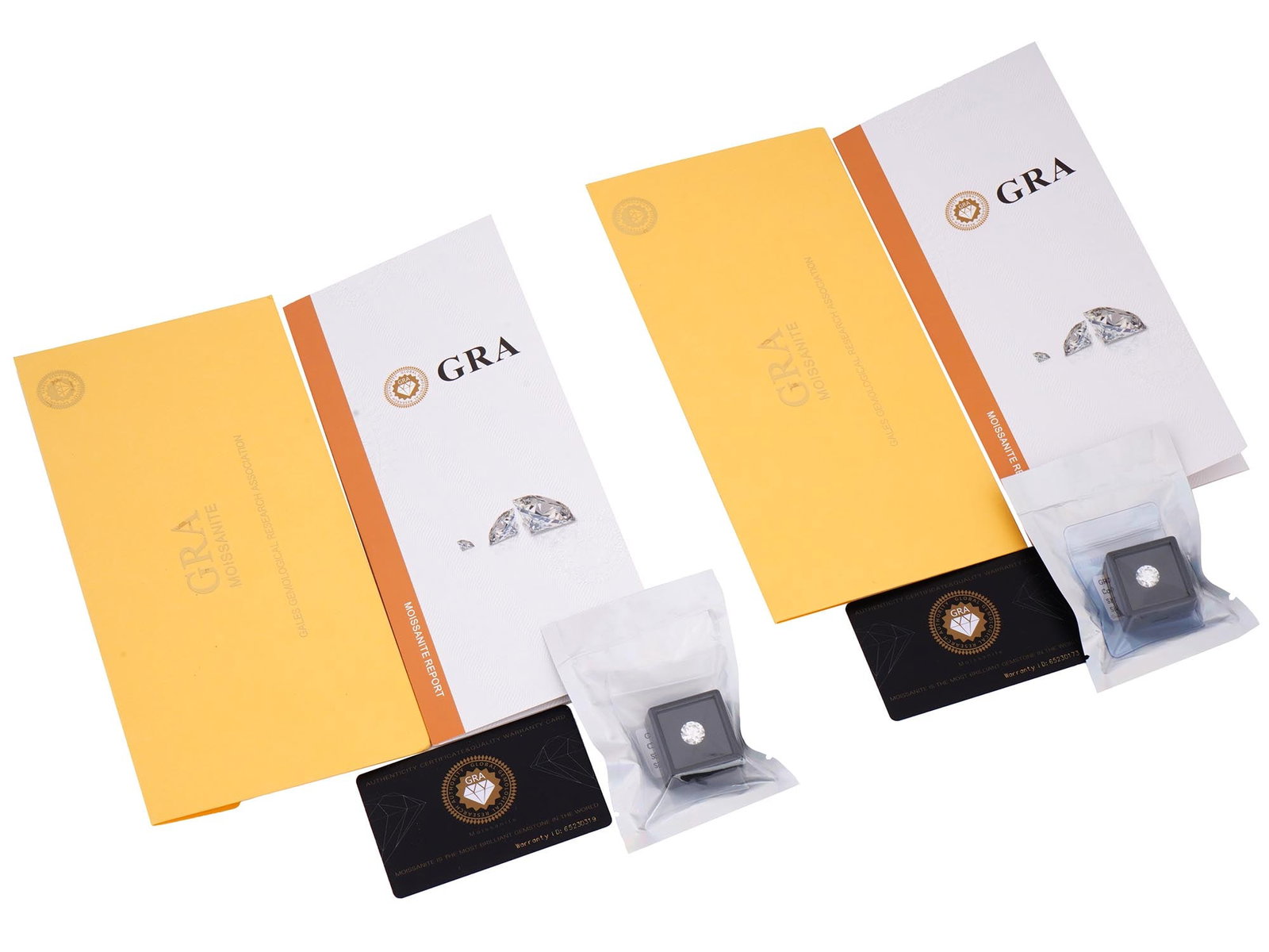 3 CT MOISSANITE GEMSTONES WITH GRA CERTIFICATES: A lot of two moissanite gemstones, 3 ct each. Round brilliant cut, color grade D. The gems come in plastic protection packaging, with individual GRA report certificates and warranty ID cards. Total We