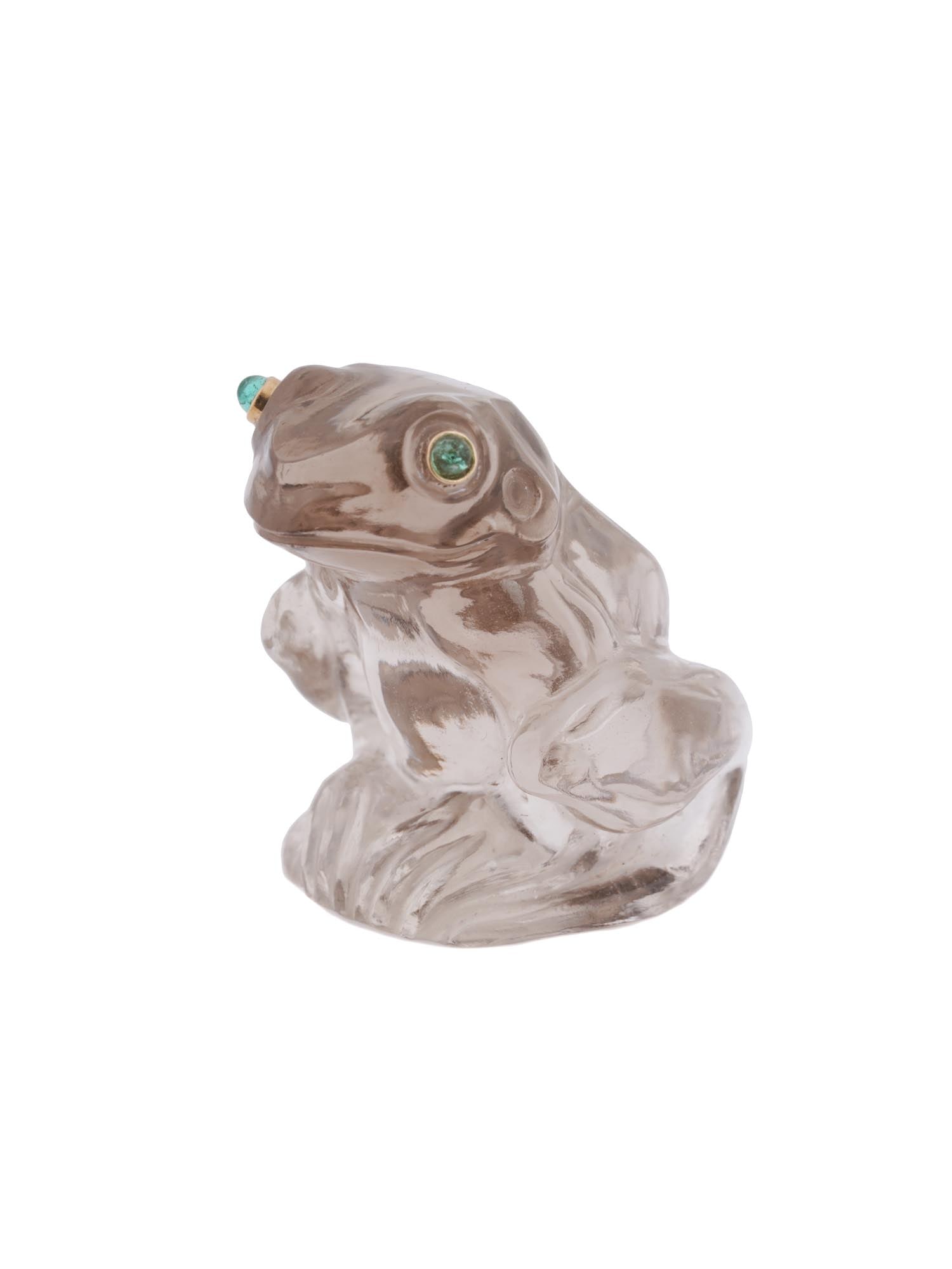 RUSSIAN CARVED SMOKY QUARTZ EMERALD FIGURE OF FROG: A Russian naturalistically hand carved Smoly Quartz figurine. The figurine depicts a frog. The figurine is adorned with engraved detailed patterns and encrusted with Emerald eyes in Gold settings. Rus