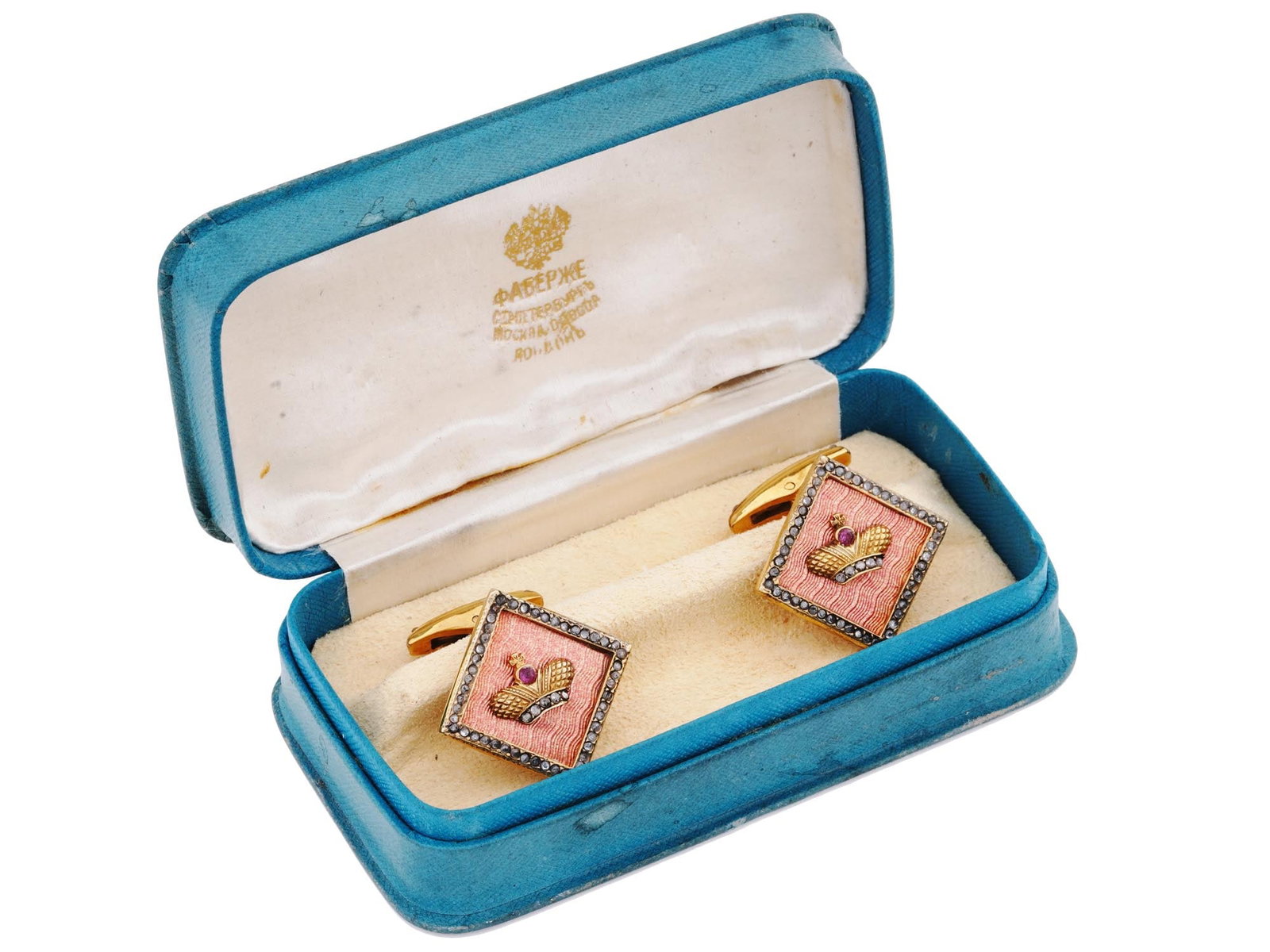 RUSSIAN GILT SILVER ENAMEL DIAMONDS CUFFLINKS IOB: A pair of Russian gilt silver whale-back cufflinks. The front parts represent a coral red guilloche enameled rhombus medallion with central crown overlay with a ruby accent and a row of diamonds along