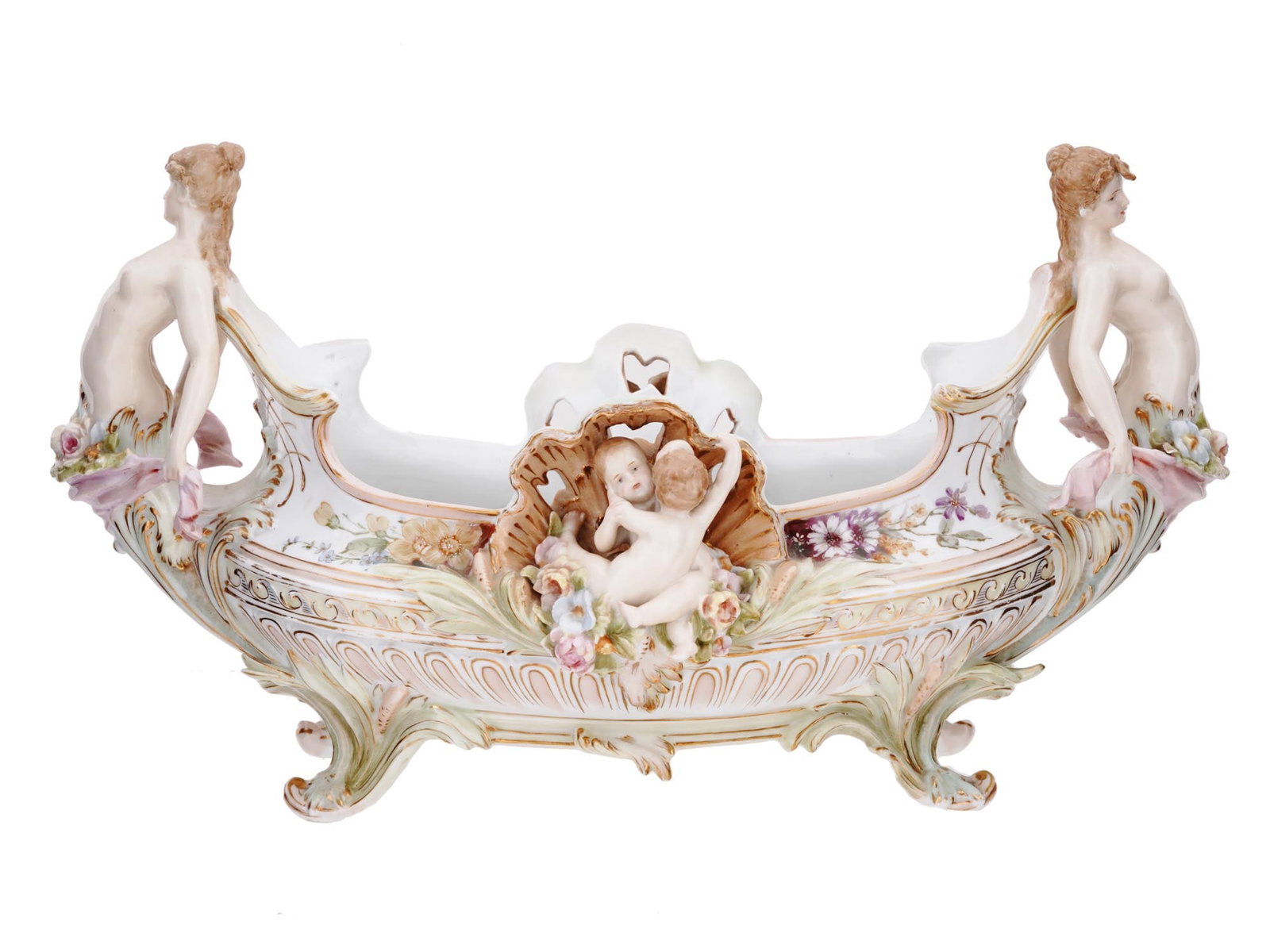 ANTIQUE GERMAN ROCOCO PORCELAIN CENTERPIECE BOWL: An antique late 18th-century German Rococo porcelain centerpiece bowl. Footed boat shape with reticulated border. Sculptural female nude handles and central shells with putti. Hand-painted floral deco