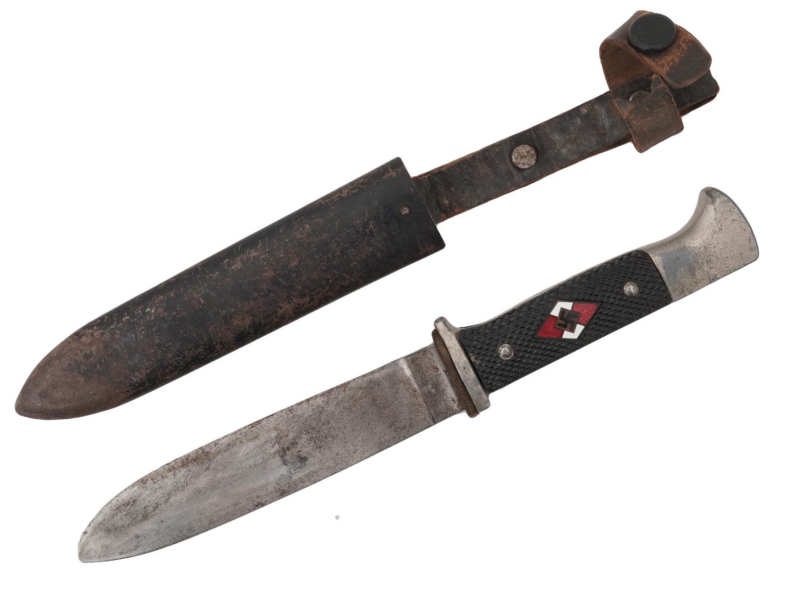 WWII NAZI GERMAN HITLER YOUTH DAGGER W SCABBARD: A WWII Nazi German Third Reich Hitler Youth member dagger. Completed with an original magnetic sheet metal scabbard. The knife has molded, black bakelite grips with an enameled rhomboid swastika insig
