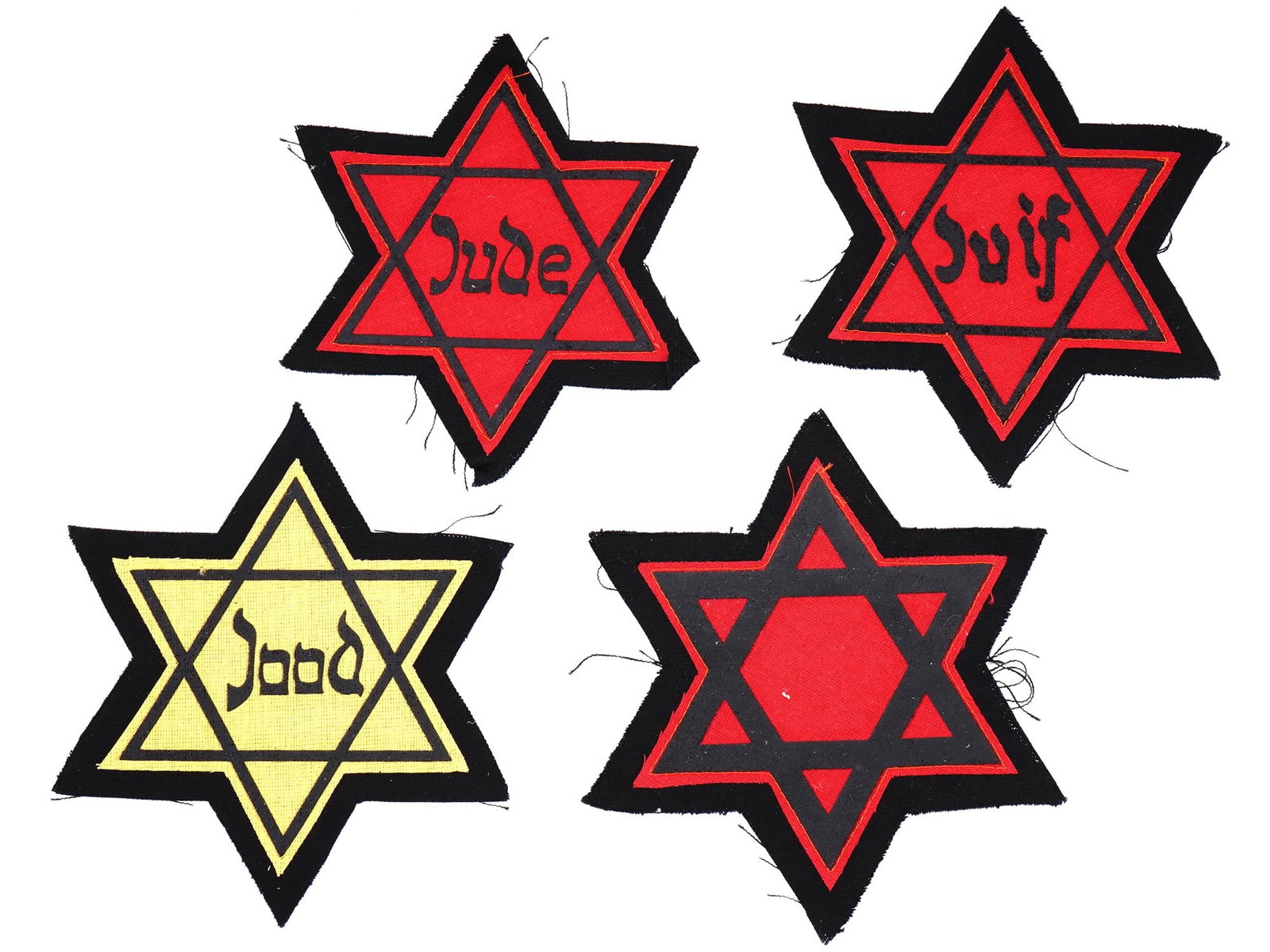 GROUP OF 4 HOLOCAUST JEWISH GHETTO STARS OF DAVID: A set of four WWII Holocaust Star of David cloth badges. The badges are inscribed, Jude, Juif, and the yellow colored badge is inscribed: Jood. One red-colored badge has no inscriptions. Each badge is