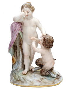 ANTIQUE MEISSEN PORCELAIN FAUN AND GIRL AFTER ACIER: A well-detailed antique porcelain figurine of Meissen Porcelain Factory. The grouping depicts a little faun kneeling before a girl. Neatly hand-painted and accented with gilding. Modeled after Michel