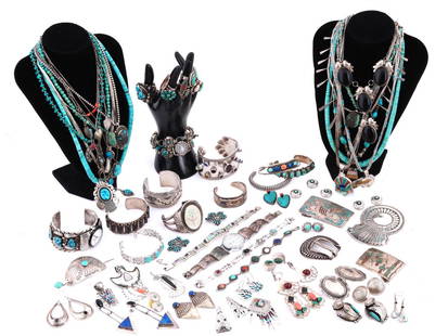 LOT OF NATIVE AMERICAN SILVER TURQUOISE JEWELRY: A lot of Native American jewelry mostly made of silver and set with natural semi precious stones like turquoise, carnelian, lapis lazuli, jasper, and other stones. The lot includes bangle bracelets, w