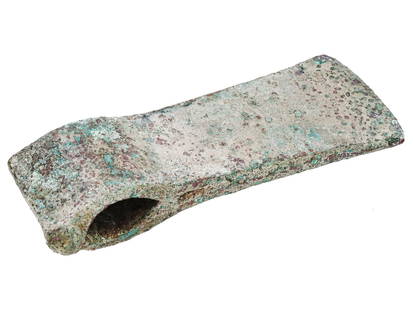 ANCIENT BALKAN BRONZE AX HEAD: An ancient Balkan bronze ax head dating from the 600s B.C. This artifact is a tangible link to the rich history and cultural heritage of the Balkan Peninsula, known for its diverse civilizations and c