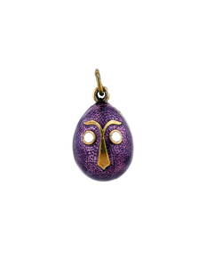 RUSSIAN SILVER GILT GUILLOCHE ENAMEL EGG PENDANT: A Russian gilt silver and enamel Easter egg pendant. The exterior of the egg is covered with a shimmering purple guilloche enamel, and adorned with a gilt silver overlay in the shape of an abstract