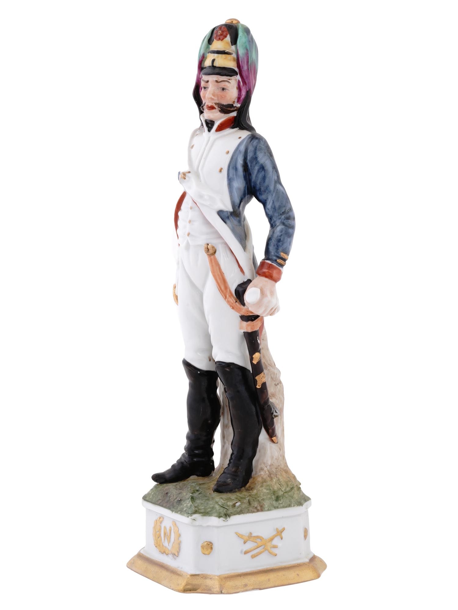 VTG CAPODIMONTE DI PIETRO PORCELAIN SOLDIER FIGURINE: A vintage Italian Capodimonte Di Pietro porcelain figurine, depicting a Napoleonic soldier with unparalleled detail and artistry on a basement adorned with the distinctive N encircled by a laurel wrea