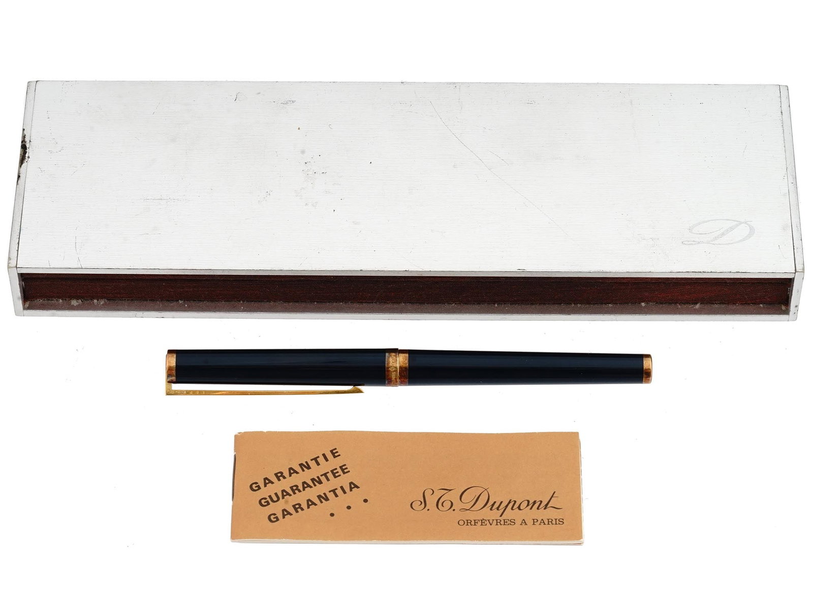 MID CENTURY ST DUPONT BALLPOINT PEN IOB: A mid-20th century ballpoint pen by S.T. Dupont, a French luxury goods brand. Ca. 1950s. Black body with gold-plated clip and details. The item comes in original box with guarantee brochure. Collectib
