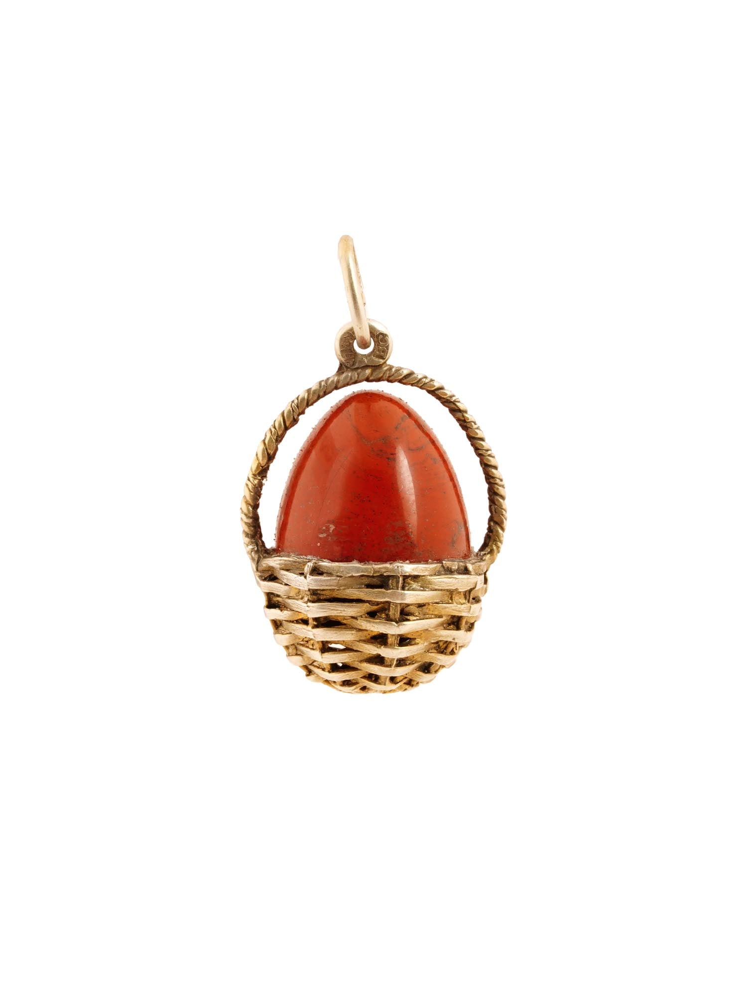 RUSSIAN GILT SILVER RED JASPER BASKET EGG PENDANT: A Russian gilt silver and red jasper pendant shaped as an egg in a basket. Hallmark of 88 silver standard and makers mark are on the fitting ring. Total Weight: 13 grams. Russian Jewelry, Silverware A