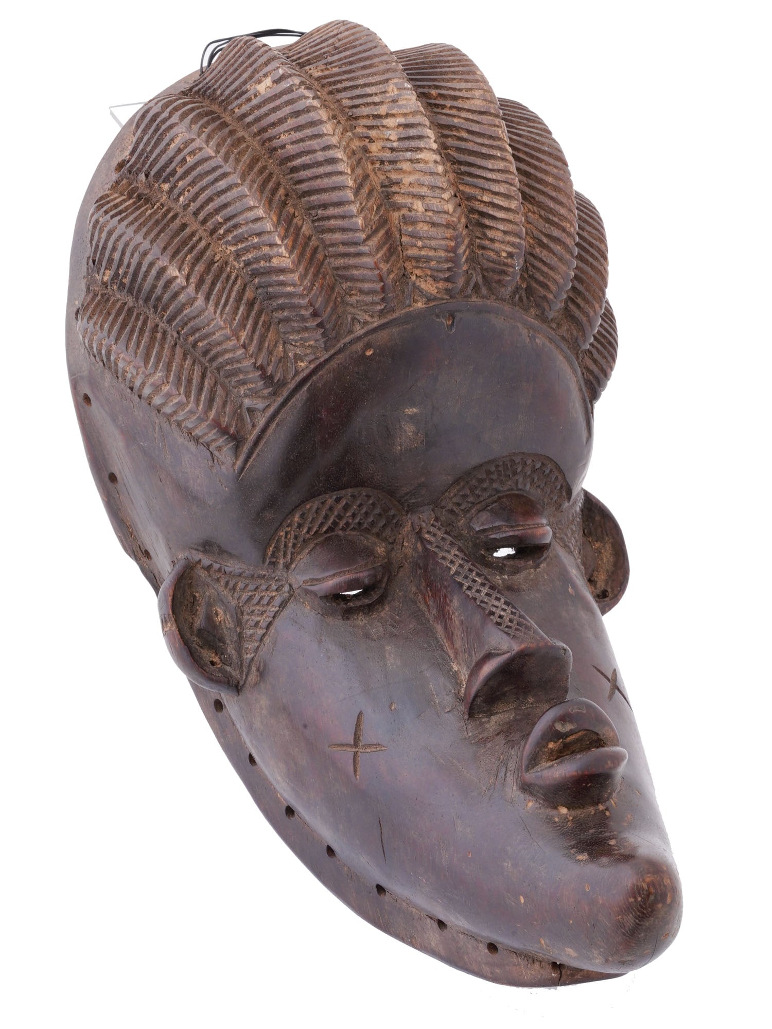 WEST AFRICAN LIBERIAN BASSA CARVED WOOD MASK: A West African Liberian Bassa carved wood mask. This mask is not only a work of art but also a testament to the cultural and spiritual significance that masks hold within West African societies.The Ba