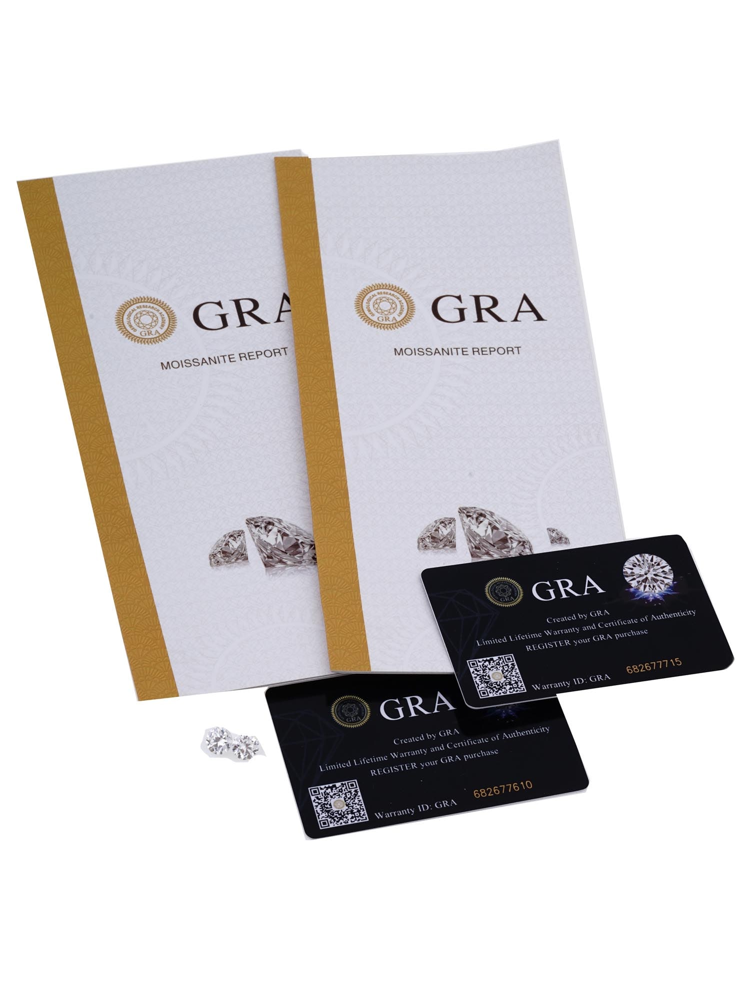 LOT OF TWO 2 CT WEIGHT MOISSANITES W CERTIFICATES: A lot of two matched moissanite mineral stones. The gemstones are cut in a round brilliant shape, the weight of each stone is 2Ct. Complete with Global Gemological Research Academy certificates. Vinta