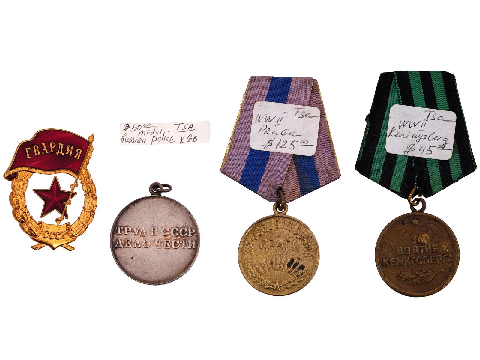 WWII RUSSIAN SOVIET MILITARY AND CIVILIAN MEDALS: A collection of genuine vintage WWII era Soviet medals including the military medals For the Capture of Konigsberg, For the Liberation of Prague, the Guardian Red Star chest badge, and the medal For L