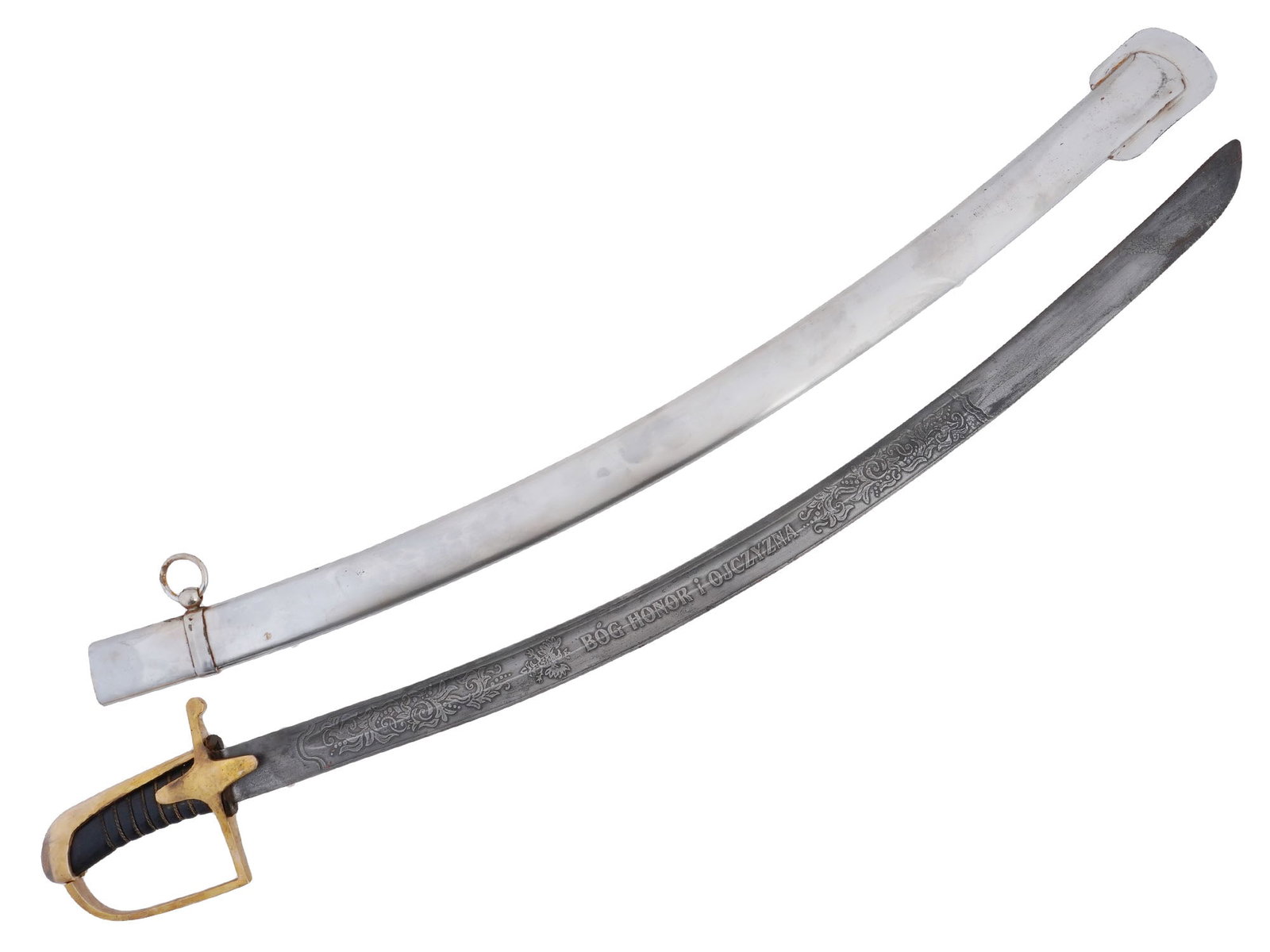 POLISH HONOR AND HOMELAND ETCHED SWORD BY A. MANN: A Polish Cavalry officers sword or saber with steel scabbard. The curved blade is made of high-quality, non-hardened steel. The blade is adorned with etched foliage and floral ornaments, an image of a