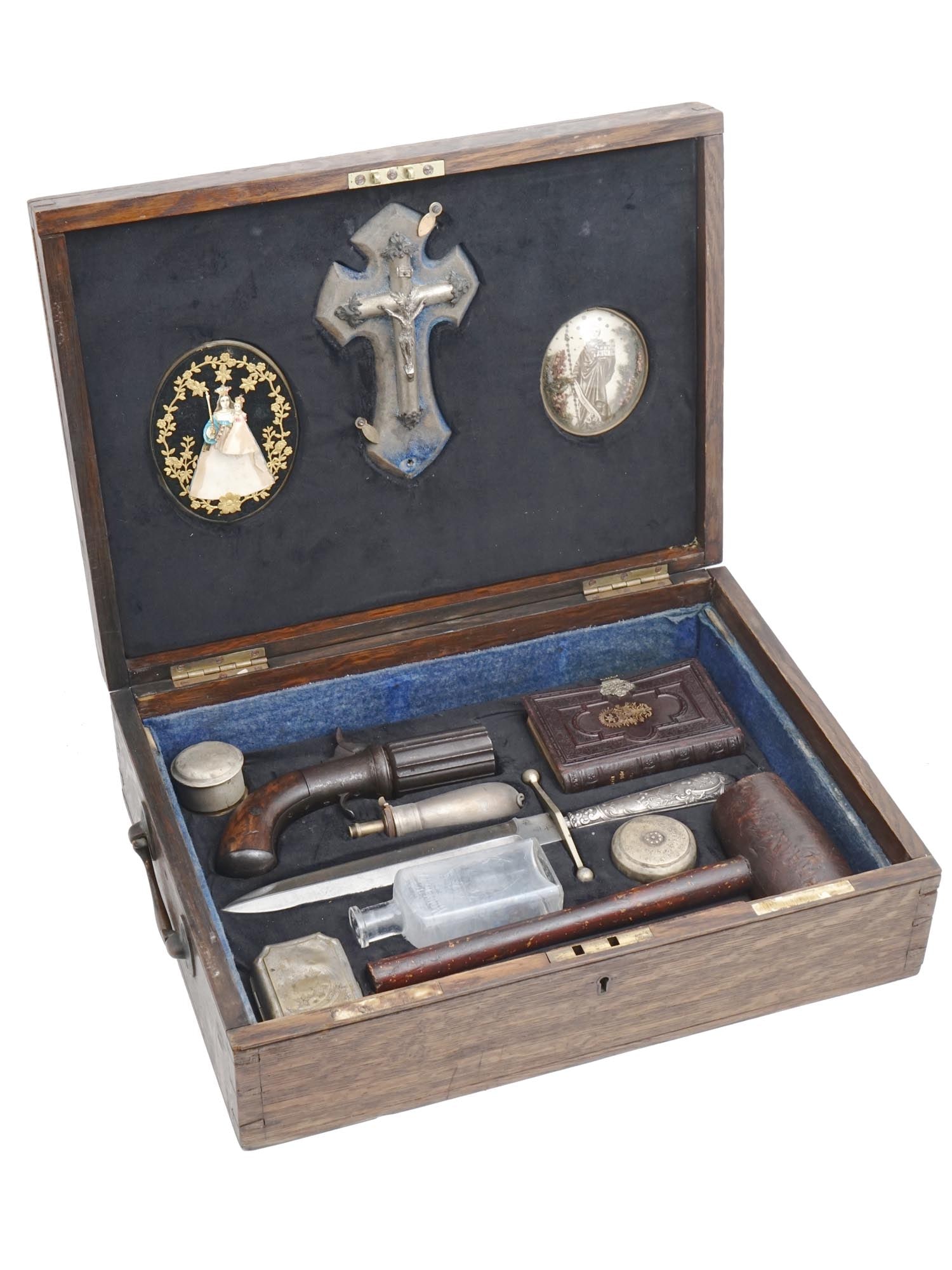 ANTIQUE 19TH C VAMPIRE HUNTER SLAYING KIT IOB: A complete antique boxed vampire hunter kit from the 19th century, presumably American. Inside comprises a pistol and a brass powder flask, a dagger with an ornate handle, a Holy Water bottle, a Bible