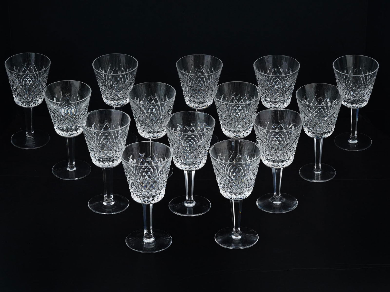 MID CENTURY WATERFORD CRYSTAL CUT WINE GLASSES: A lot of mid-20th century cut lead crystal wineglasses by Waterford Crystal, an Irish glass manufacture. A total of 14 goblets. Taper-shaped bowls with cut diamond pattern. Glassware And Drinkware, Cl