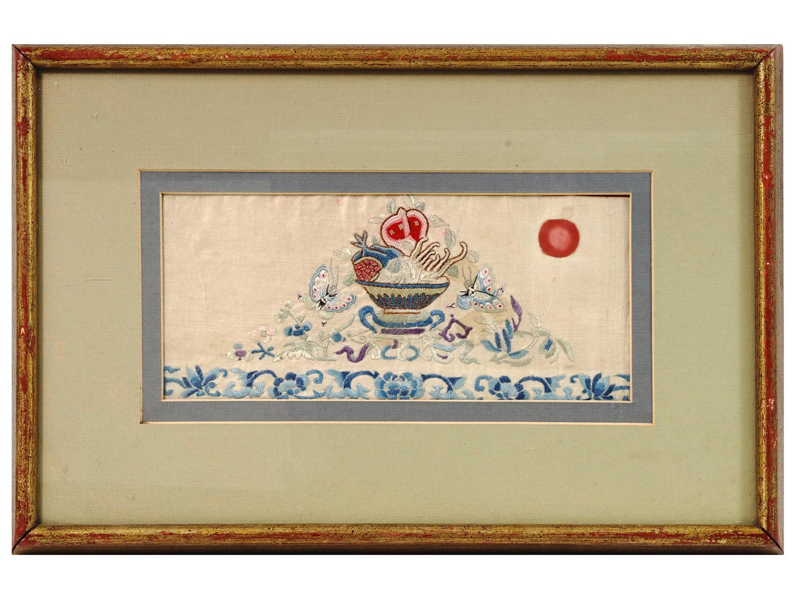 CHINESE EMBROIDERED WATERCOLOR PAINTING ON SILK: A small antique Chinese, late Meiji era, hand embroidered watercolor painting on silk depicting a still life with a vase with fruits, adorned with butterflies, floral, and foliage motifs, and probably