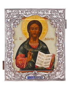 ANTIQUE RUSSIAN ICON JESUS CHRIST IN SILVER OKLAD: An antique 19th-century Russian Orthodox icon of Jesus Christ in Pantocrator iconography, known in the Western Christianity as Christ in Majesty. Mixed media painting: egg tempera, gesso, and levkas