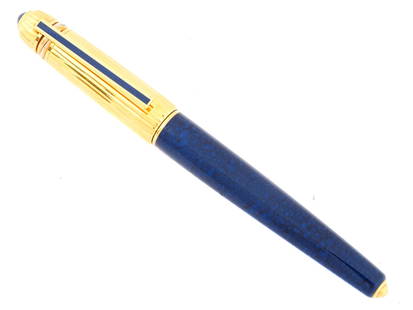 1980S PASHA DE CARTIER BLUE LACQUER BALLPOINT PEN: A vintage ballpoint pen by Cartier. Pasha de Cartier collection. Serial number 1988 4787. Ca. 1980s. Polished blue marble lacquer barrel. 18K gold-plated cap with Trinity rings, cabochon finial,