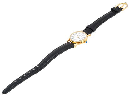 VINTAGE TIFFANY AND CO 14K GOLD LADIES WATCH: A vintage Tiffany and Co. 14K gold womens wrist watch with a black leather band. Features a 18k yellow gold bezel with a white face and black roman numeral markers, marked, Tiffany and Co. The back is