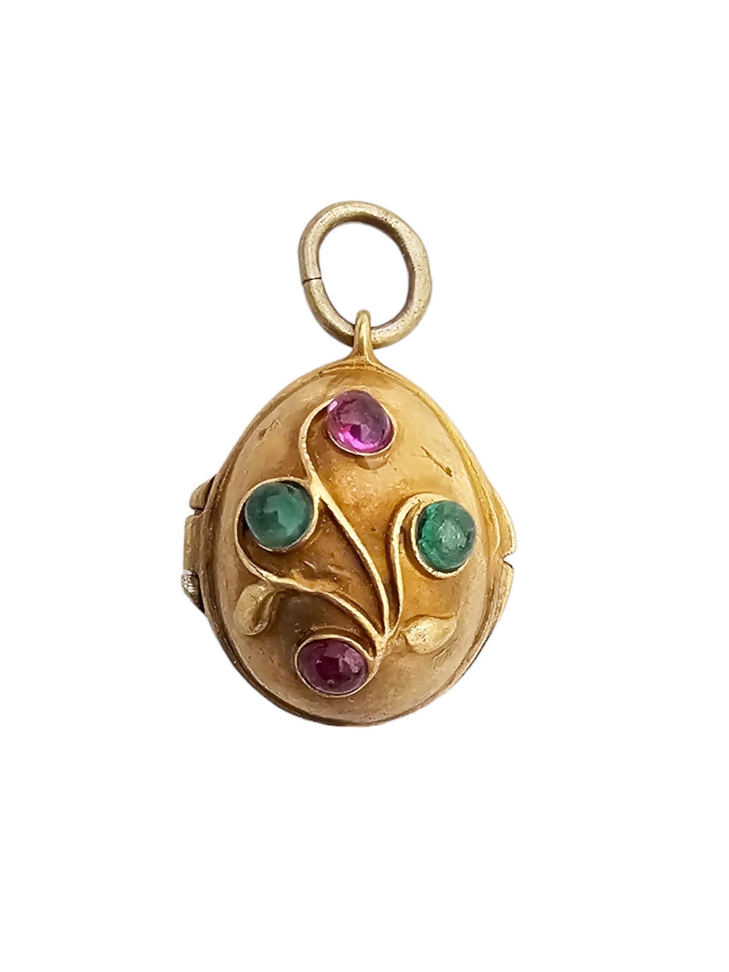 RUSSIAN GILT SILVER GEMSTONES EGG LOCKET PENDANT: A Russian gilt silver egg-shaped locket pendant. The piece is decorated with overlay floral stems and semiprecious stone cabochons of various colors. Hallmark of 84 silver standard and makers mark are